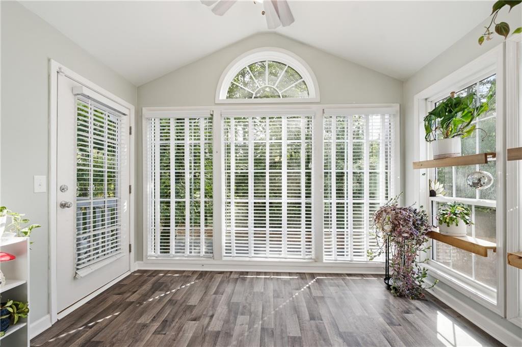 1007 Olde Mill Lane Norcross, GA 30093 - Photo 11 of 32 a view of an empty room with wooden floor and a window