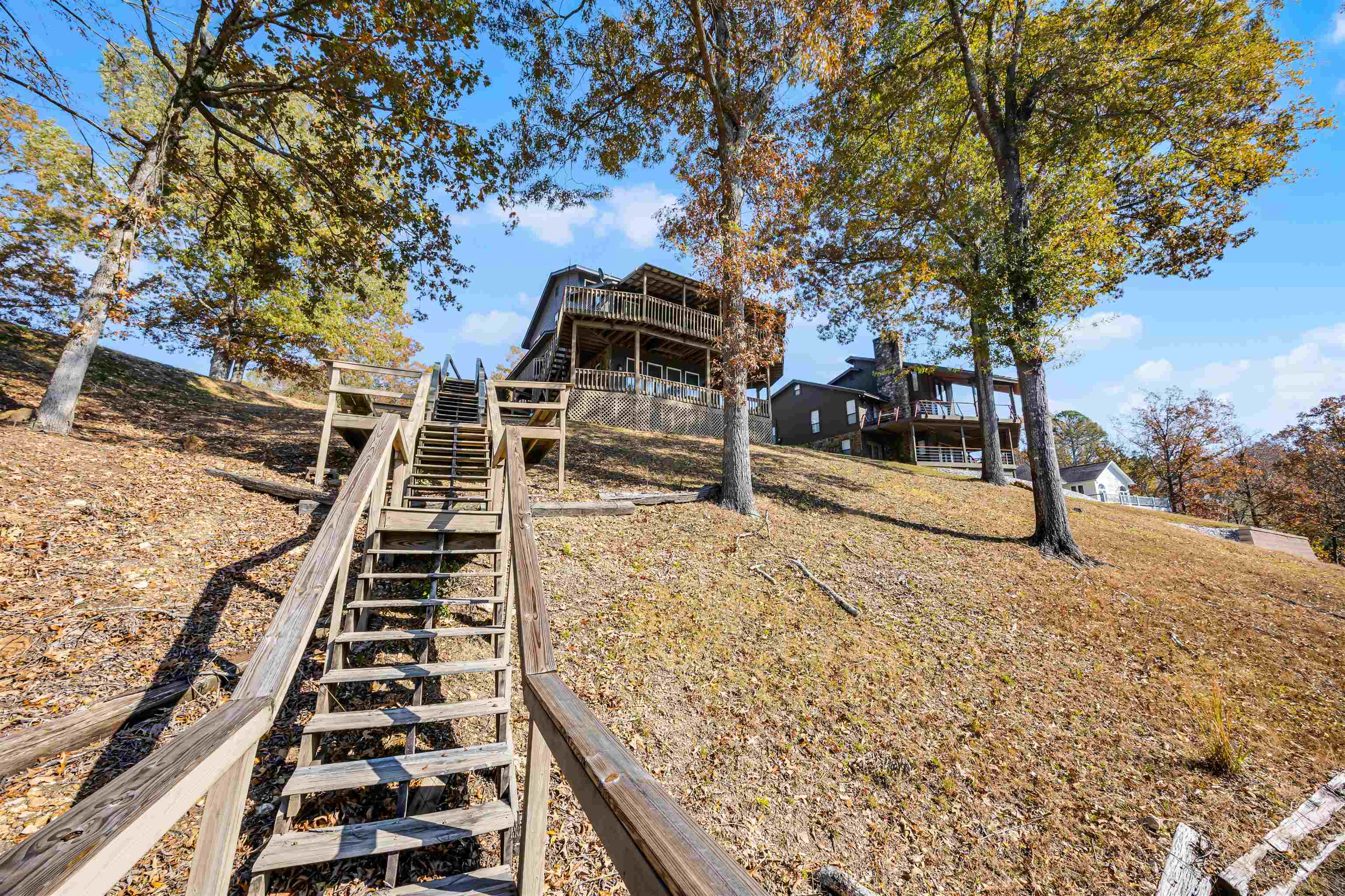 80 Riviera Cove Cherokee, AL 35616 - Photo 24 of 31 View of yard featuring stairs and a wooden deck