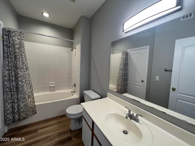 a bathroom with a sink toilet tub and shower