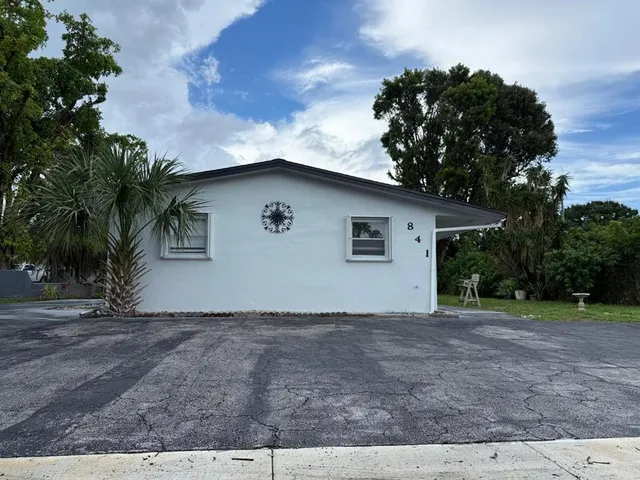 a house with trees in the background