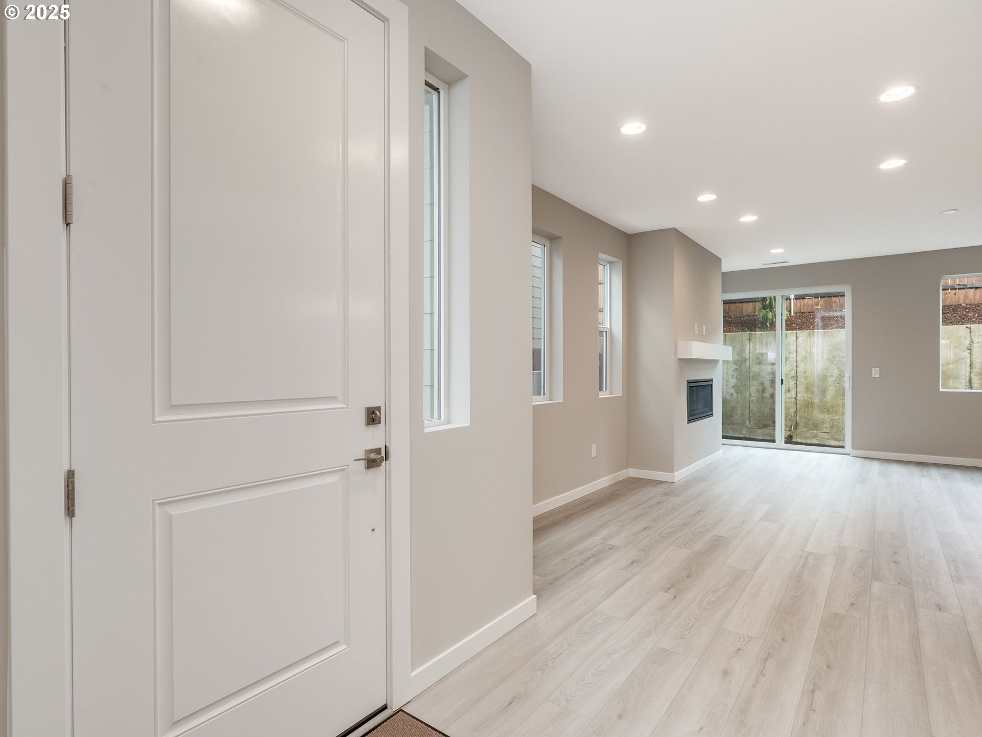 712 Northwest 178th Street Ridgefield, WA 98642 - Photo 5 of 41 an empty room with wooden floor and windows