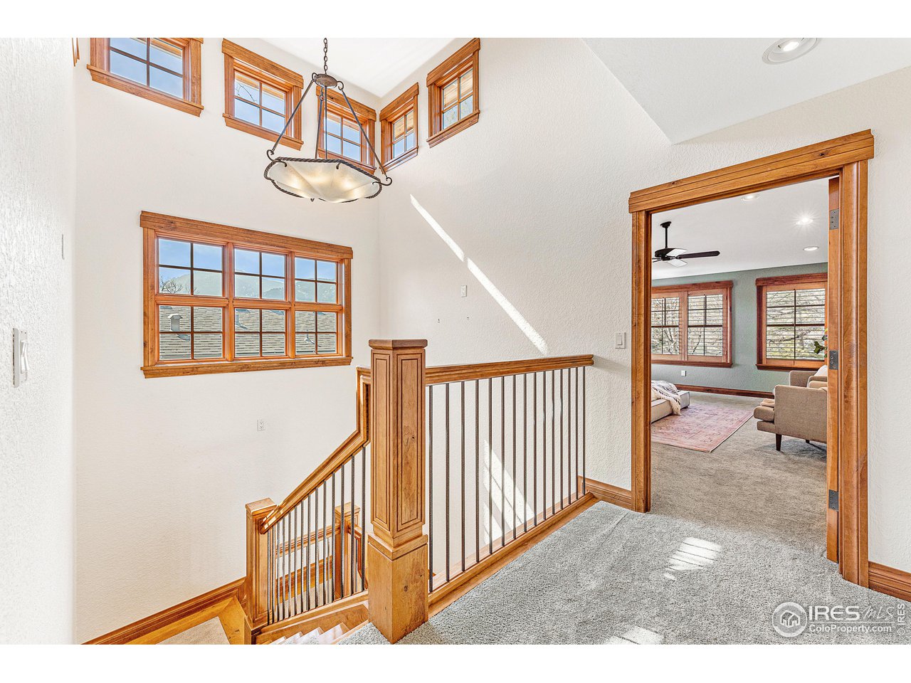 3024 8th Street Boulder, CO 80304 - Photo 24 of 37 elegant wood stairs split primary apart from two additional upstairs bedrooms