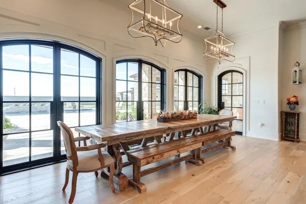a bedroom with a bed dresser and flat screen tv