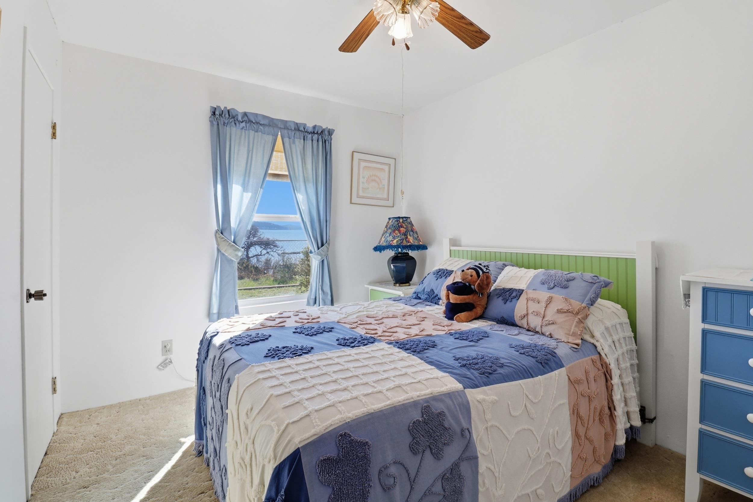 919 Lakeshore Loop Tow, TX 78672 - Photo 26 of 33 a bedroom with a bed and painting on the wall