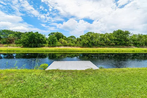 a view of a swimming pool with a yard