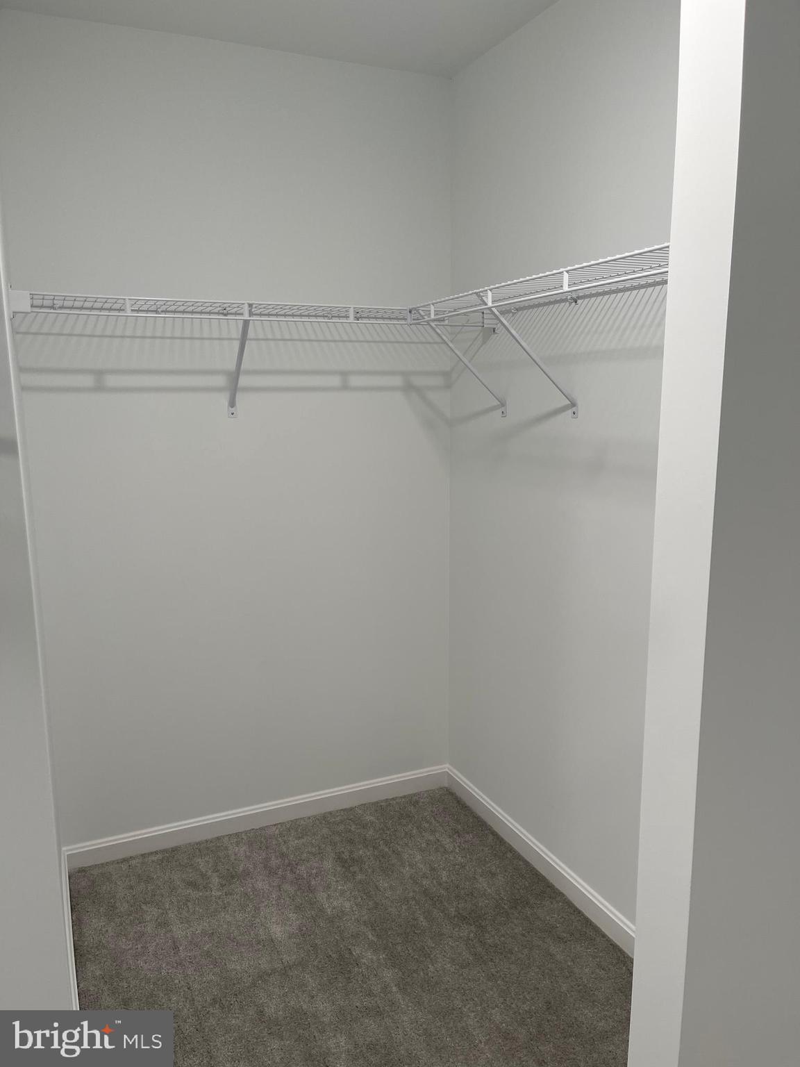 5562 Cherry Hill Road Huntingtown, MD 20639 - Photo 33 of 35 a view of a room with racks on the wall