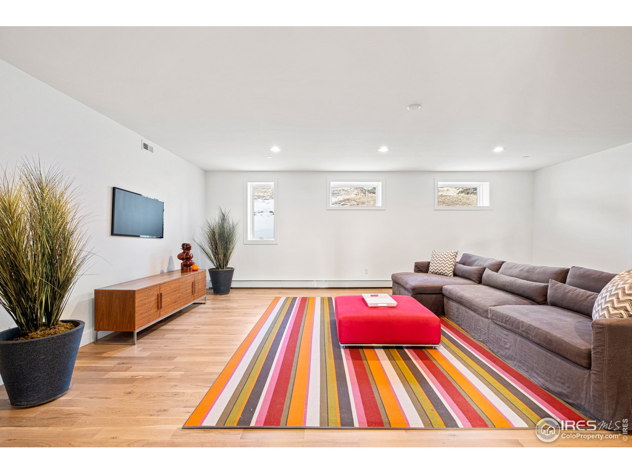 4872 Sugarloaf Road Boulder, CO 80302 - Photo 11 of 40 a living room with furniture and a flat screen tv
