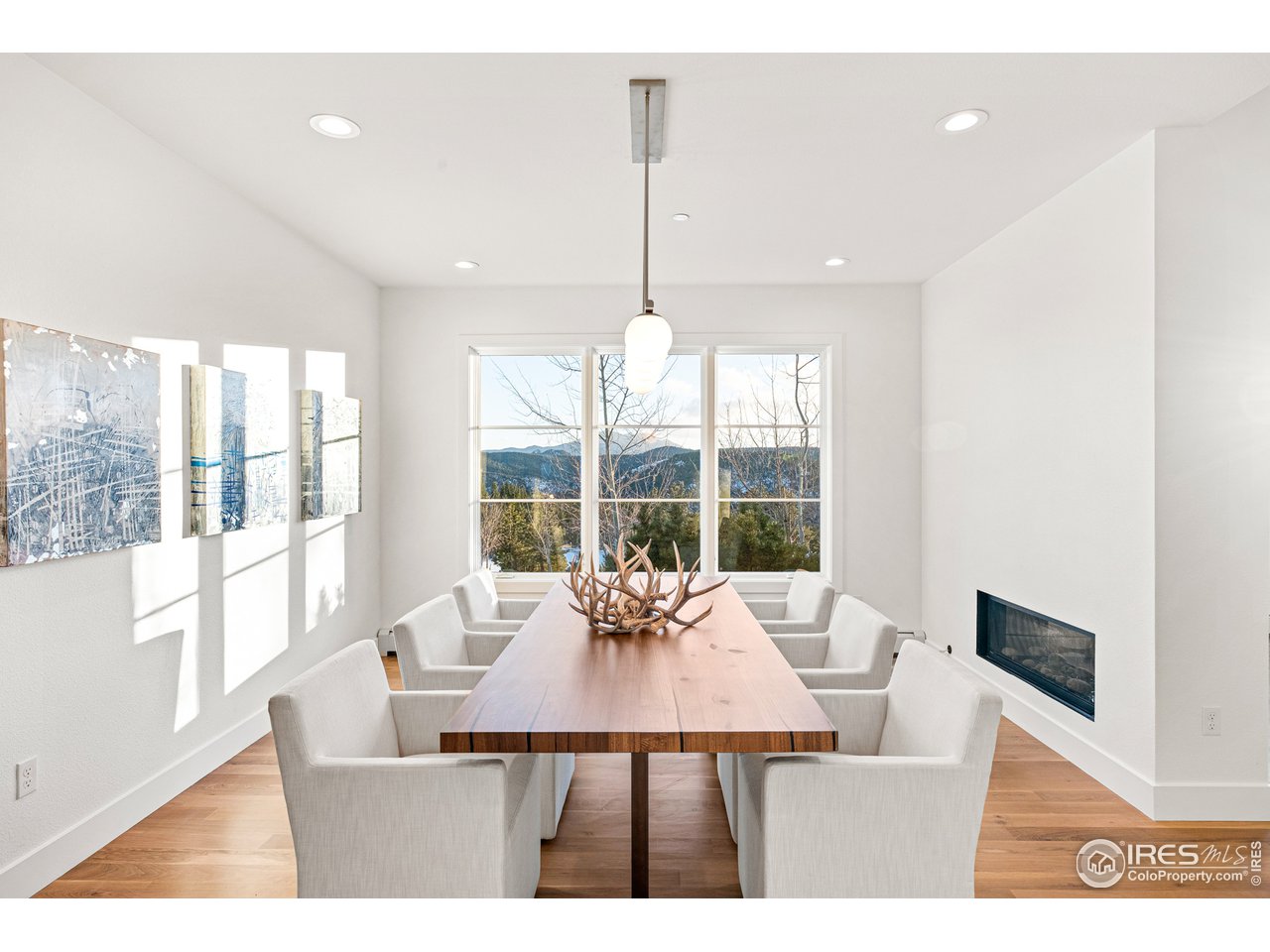 4872 Sugarloaf Road Boulder, CO 80302 - Photo 12 of 40 a dining room with furniture a chandelier and wooden floor