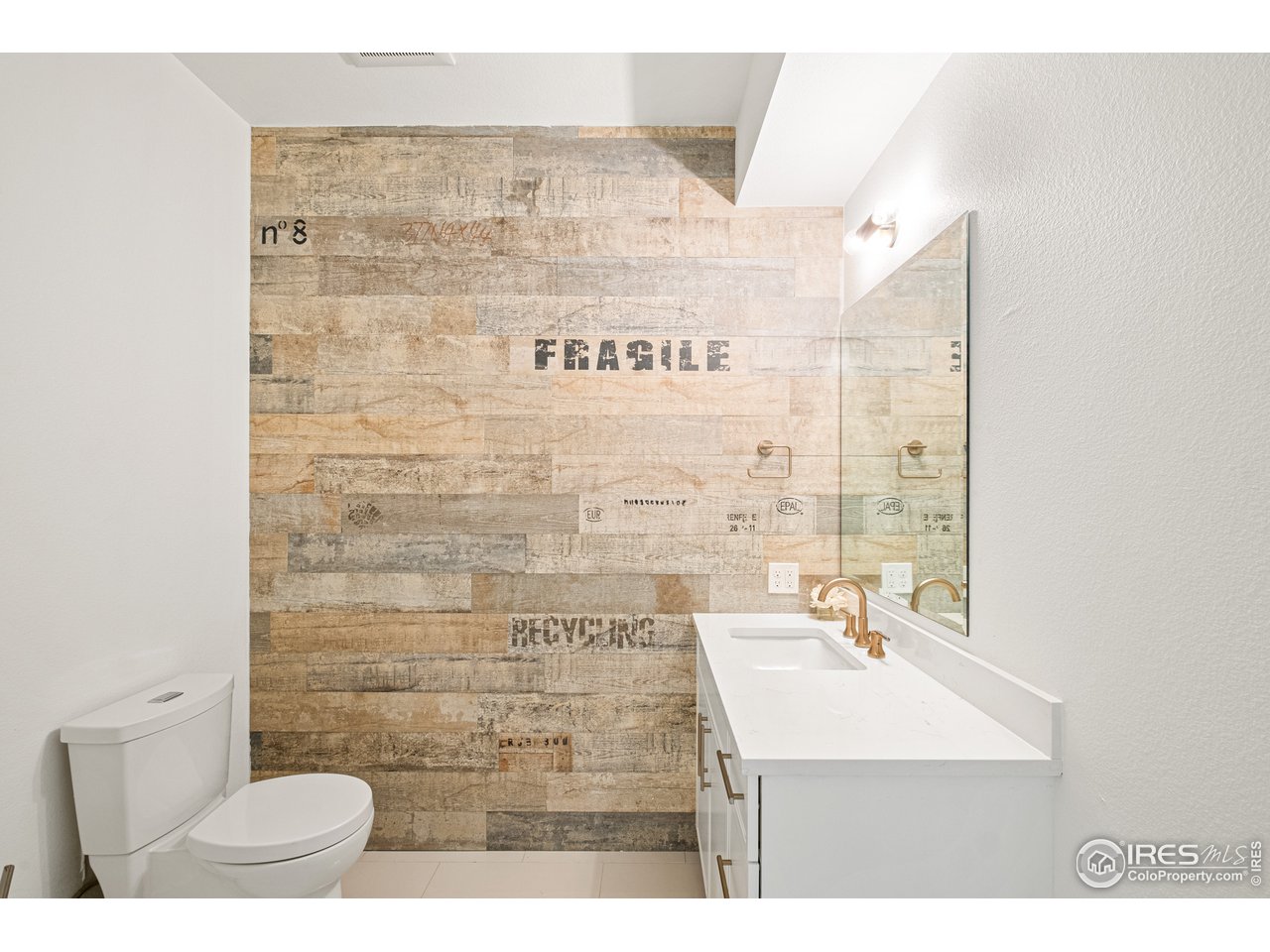 4872 Sugarloaf Road Boulder, CO 80302 - Photo 14 of 40 a bathroom with a sink a mirror and a shower