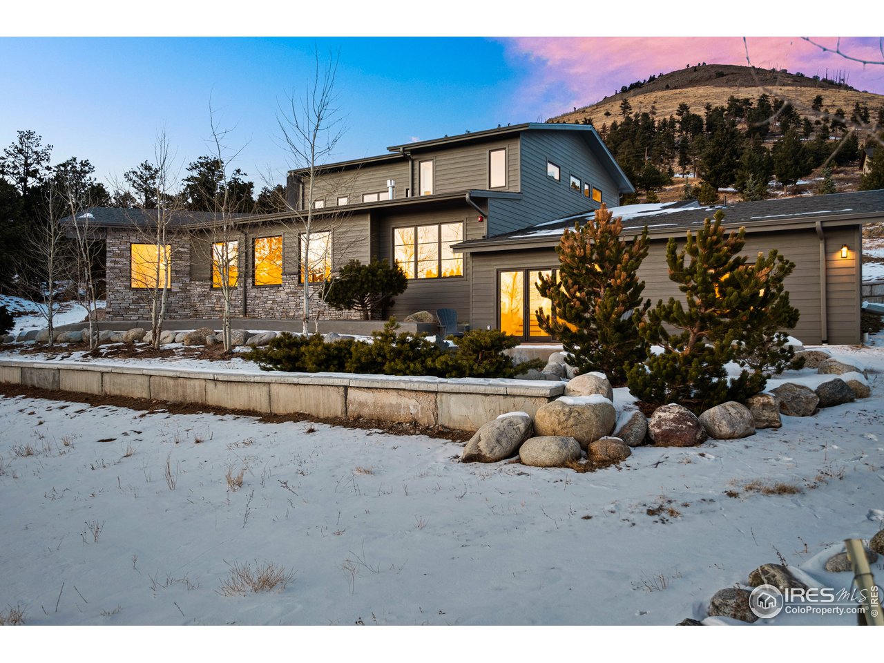 4872 Sugarloaf Road Boulder, CO 80302 - Photo 2 of 40 a front view of a house with a yard