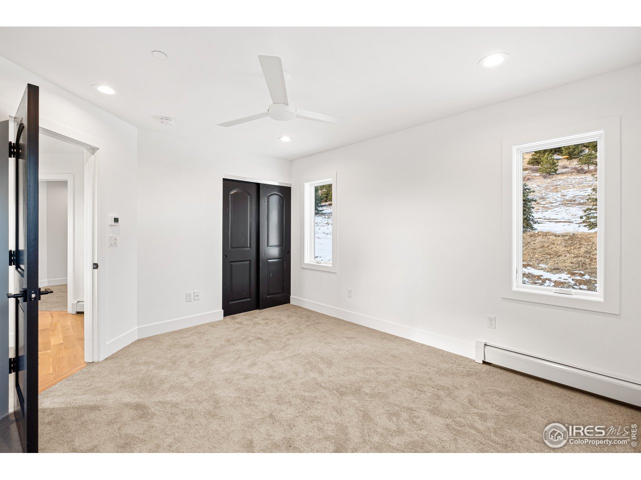 4872 Sugarloaf Road Boulder, CO 80302 - Photo 20 of 40 a view of an empty room with a window