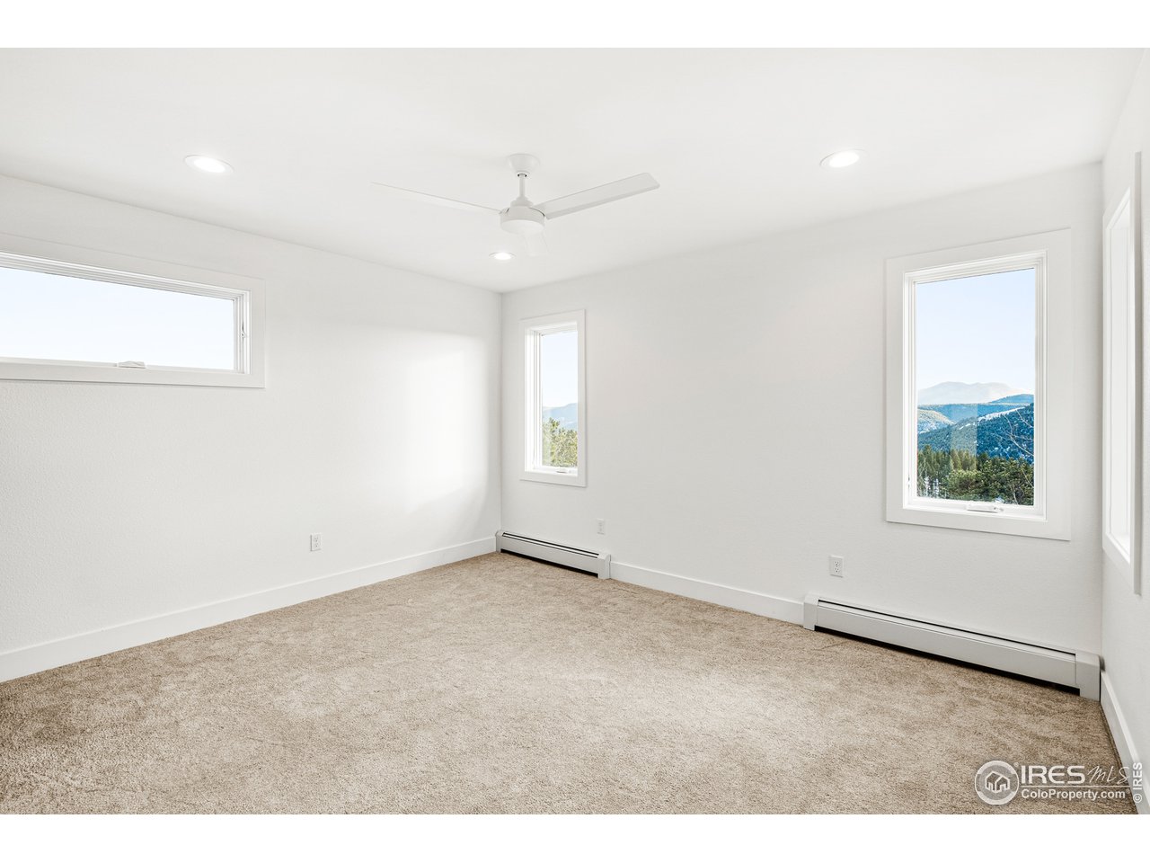 4872 Sugarloaf Road Boulder, CO 80302 - Photo 22 of 40 a view of an empty room with a window