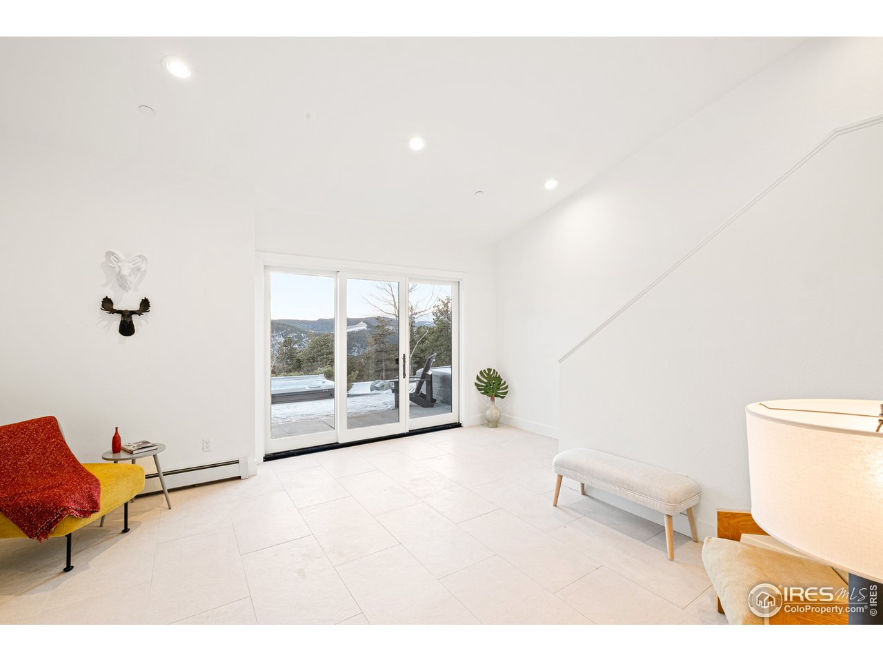 4872 Sugarloaf Road Boulder, CO 80302 - Photo 25 of 40 a room with furniture and a rug