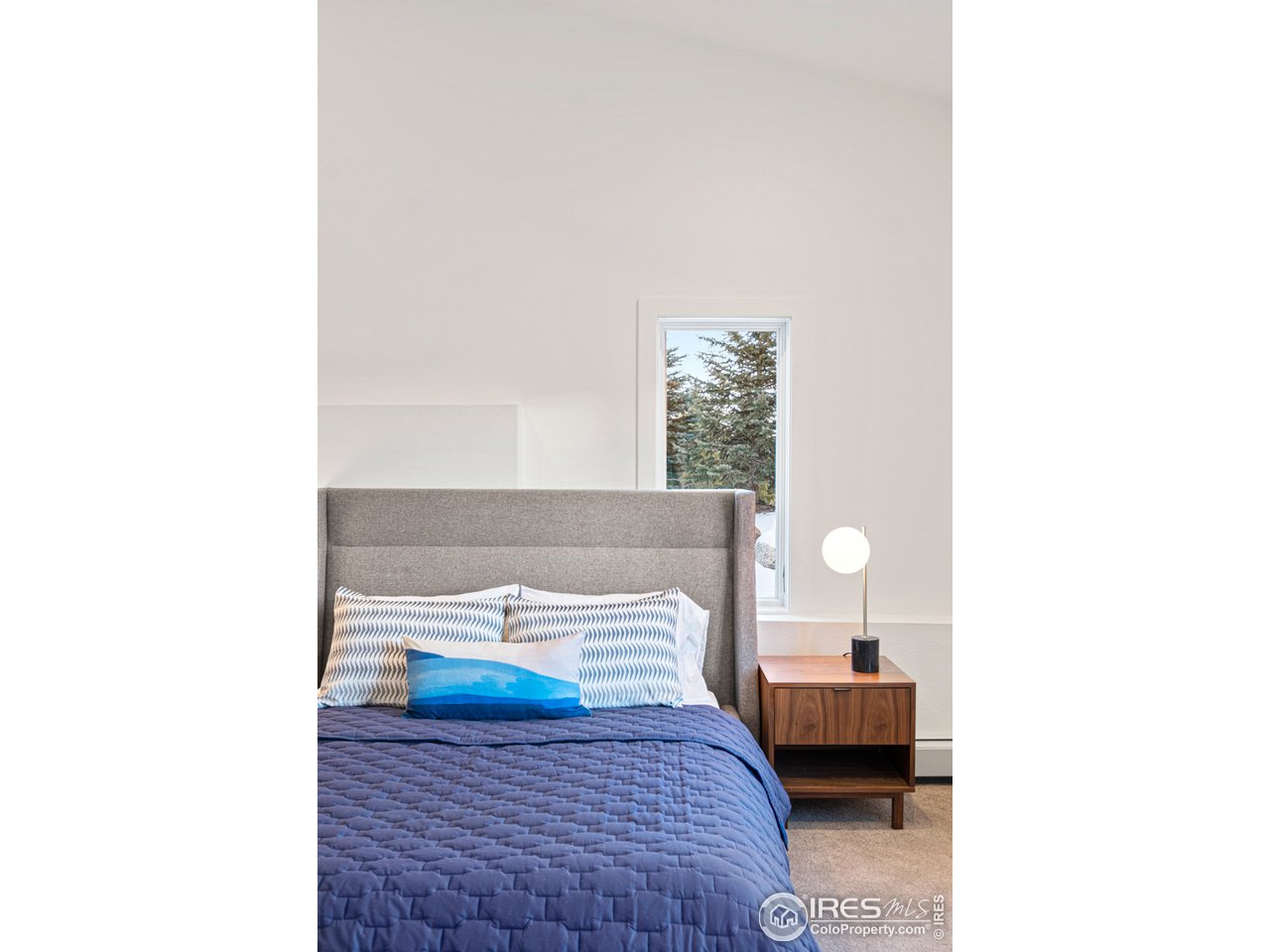 4872 Sugarloaf Road Boulder, CO 80302 - Photo 26 of 40 a bedroom with a bed and a window