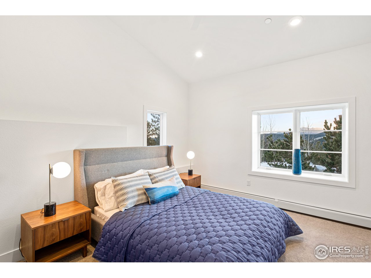 4872 Sugarloaf Road Boulder, CO 80302 - Photo 27 of 40 a bedroom with a bed and window