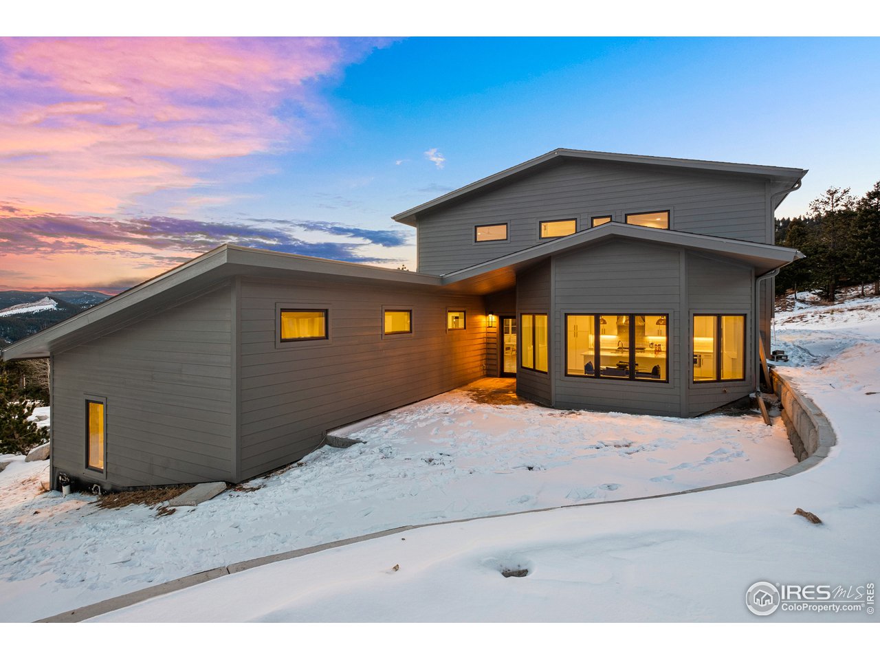 4872 Sugarloaf Road Boulder, CO 80302 - Photo 34 of 40 a view of a livingroom with a fireplace