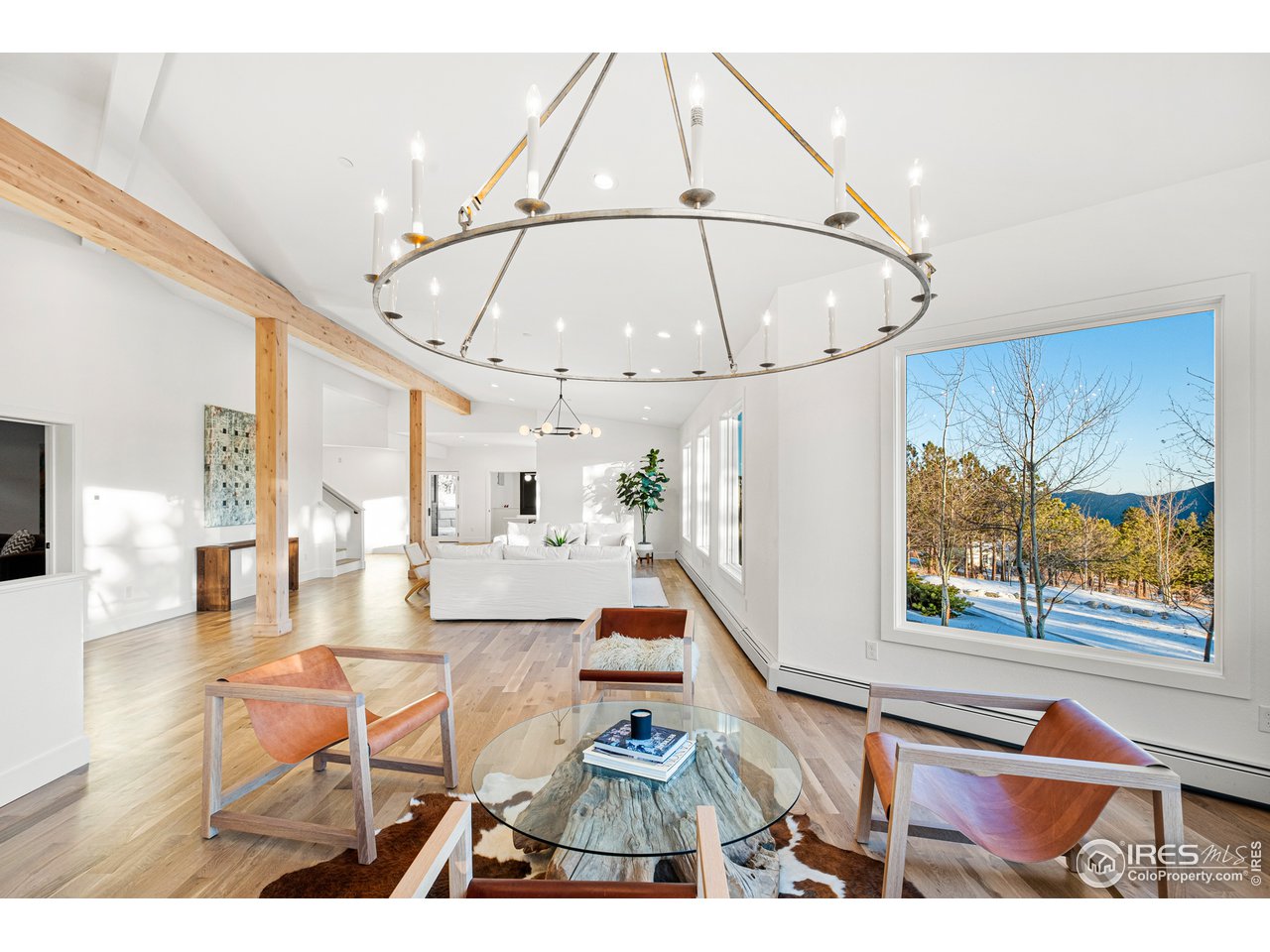 4872 Sugarloaf Road Boulder, CO 80302 - Photo 6 of 40 a living room with furniture and a chandelier