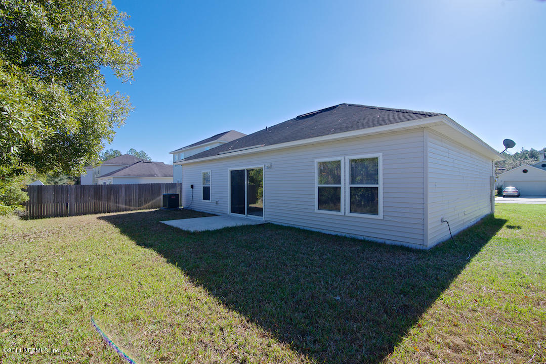 7170 Rampart Ridge Circle West Jacksonville, FL 32244 - Photo 19 of 22 a front view of a house with garden