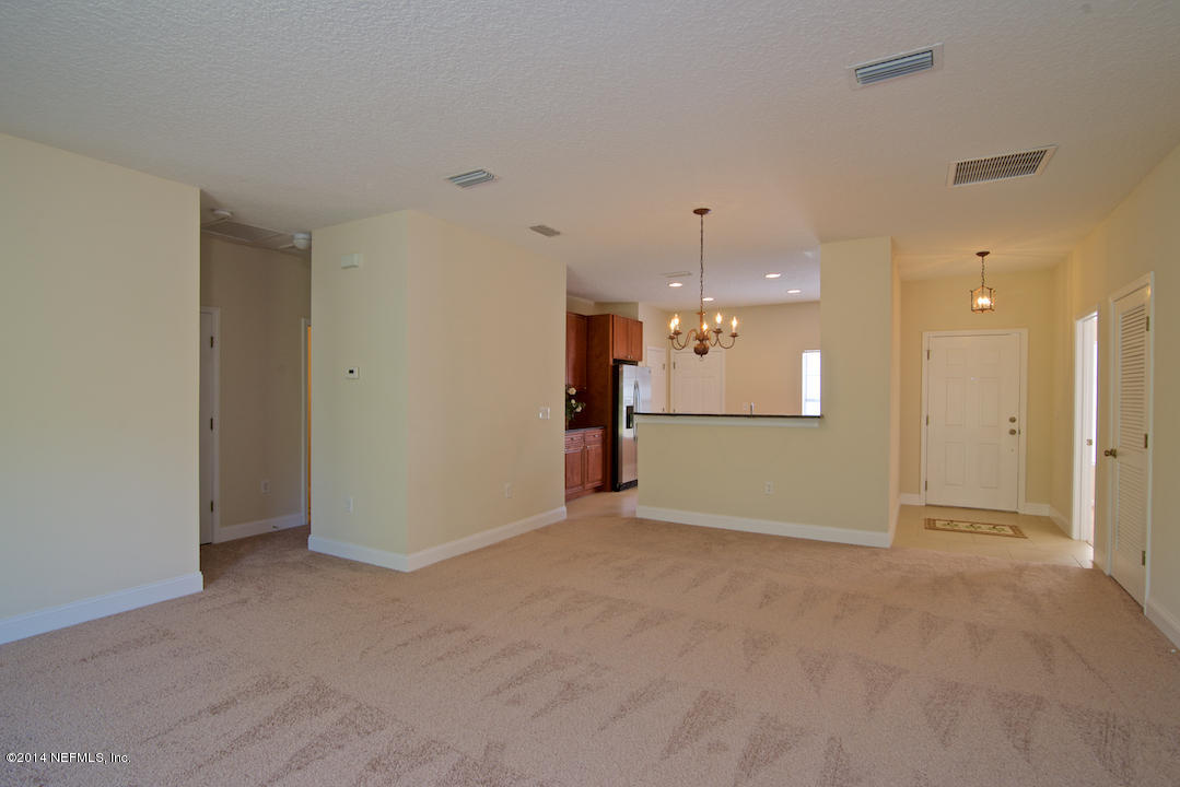 7170 Rampart Ridge Circle West Jacksonville, FL 32244 - Photo 6 of 22 an empty room with a kitchen and a kitchen view