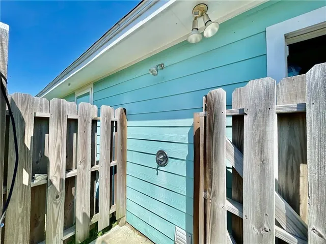 a view of walk in closet with wooden floor