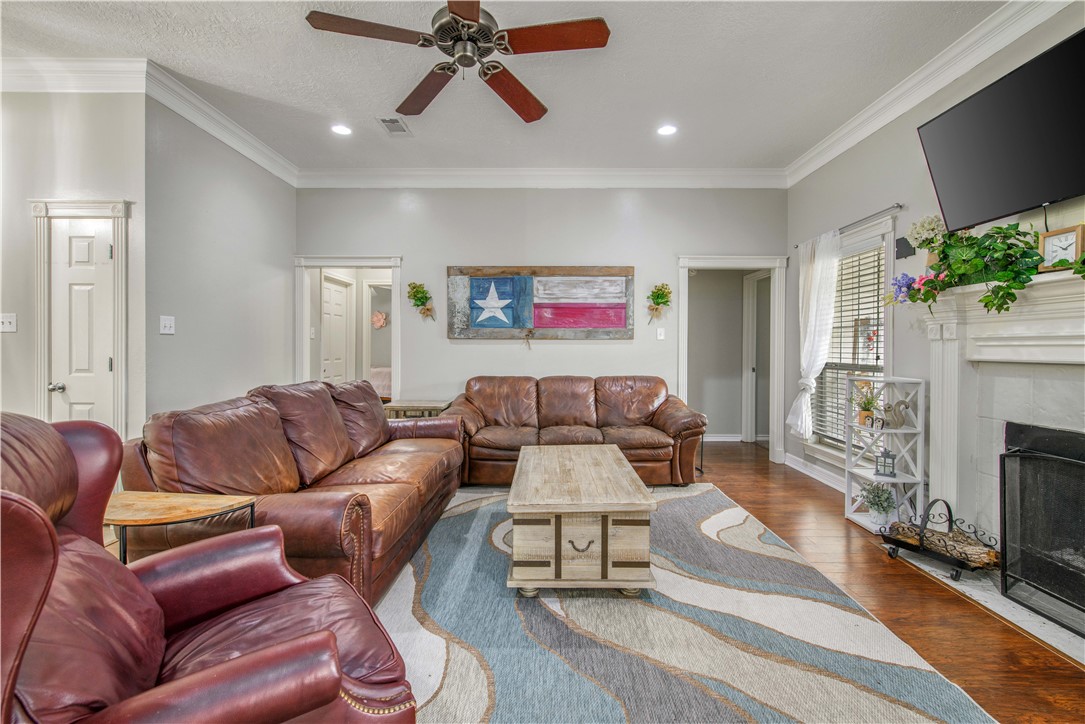 6538 Olympia Buddy Road College Station, TX 77845 - Photo 12 of 50 a living room with furniture and a fireplace