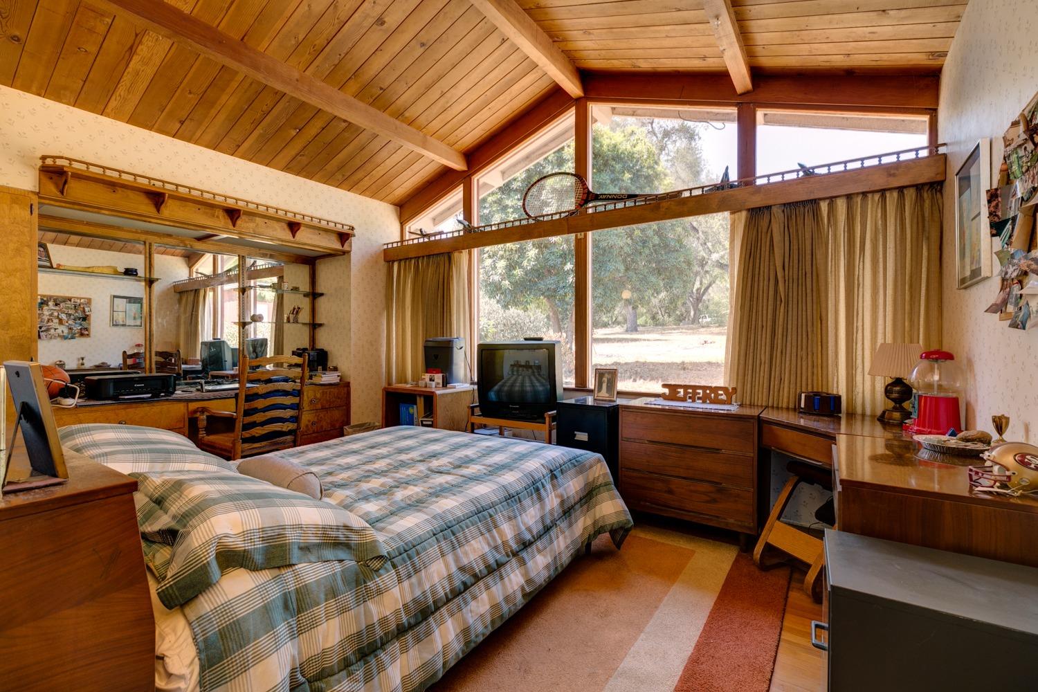 516 Palomar Road Ojai, CA 93023 - Photo 19 of 45 a bedroom with furniture and large windows