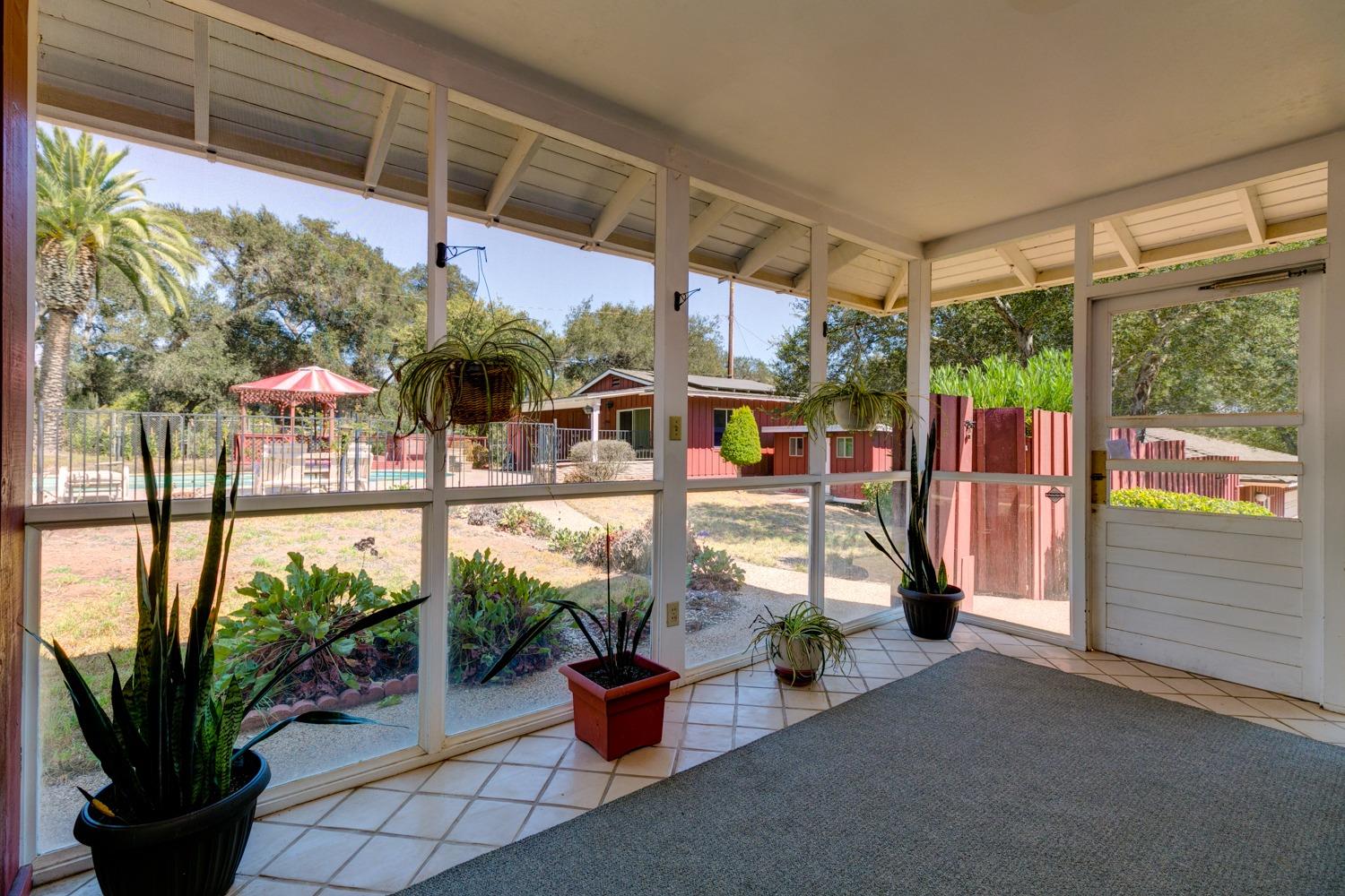 516 Palomar Road Ojai, CA 93023 - Photo 24 of 45 a view of a porch with potted plants