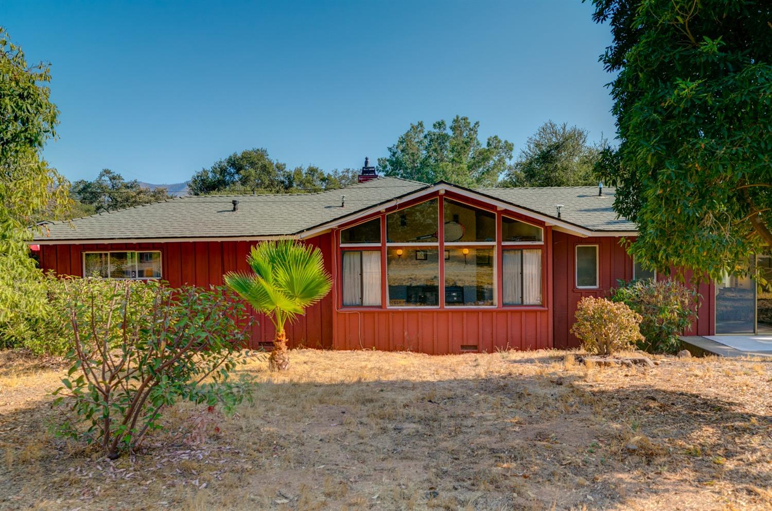 516 Palomar Road Ojai, CA 93023 - Photo 31 of 45 a front view of a house with a yard and garage