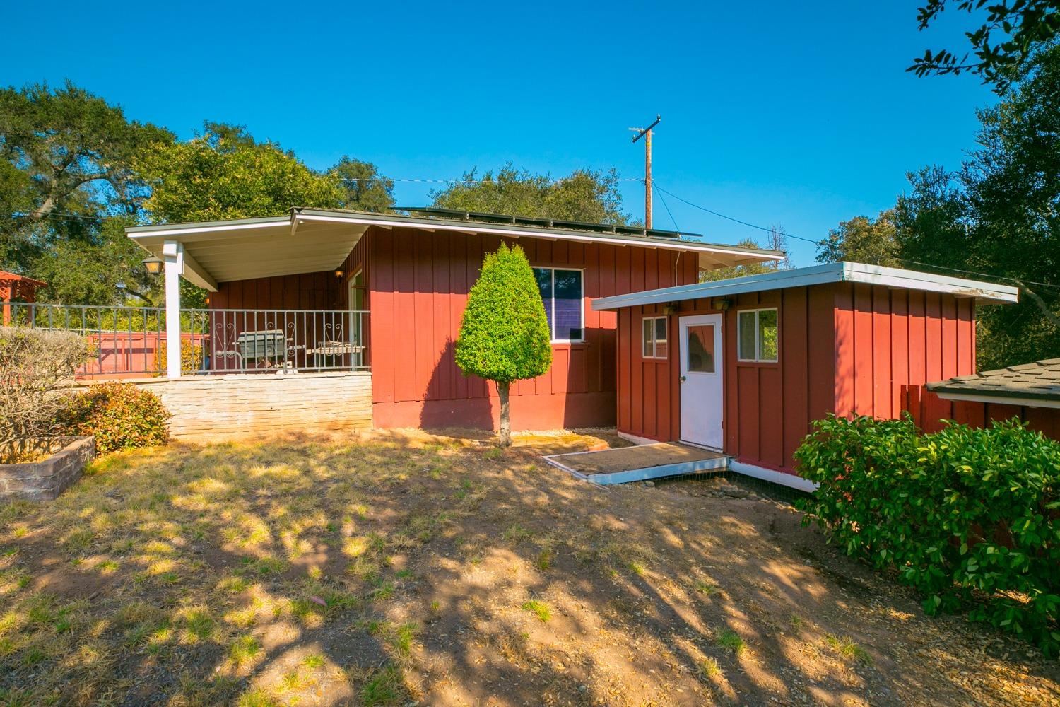 516 Palomar Road Ojai, CA 93023 - Photo 33 of 45 a front view of a house with a yard and potted plants