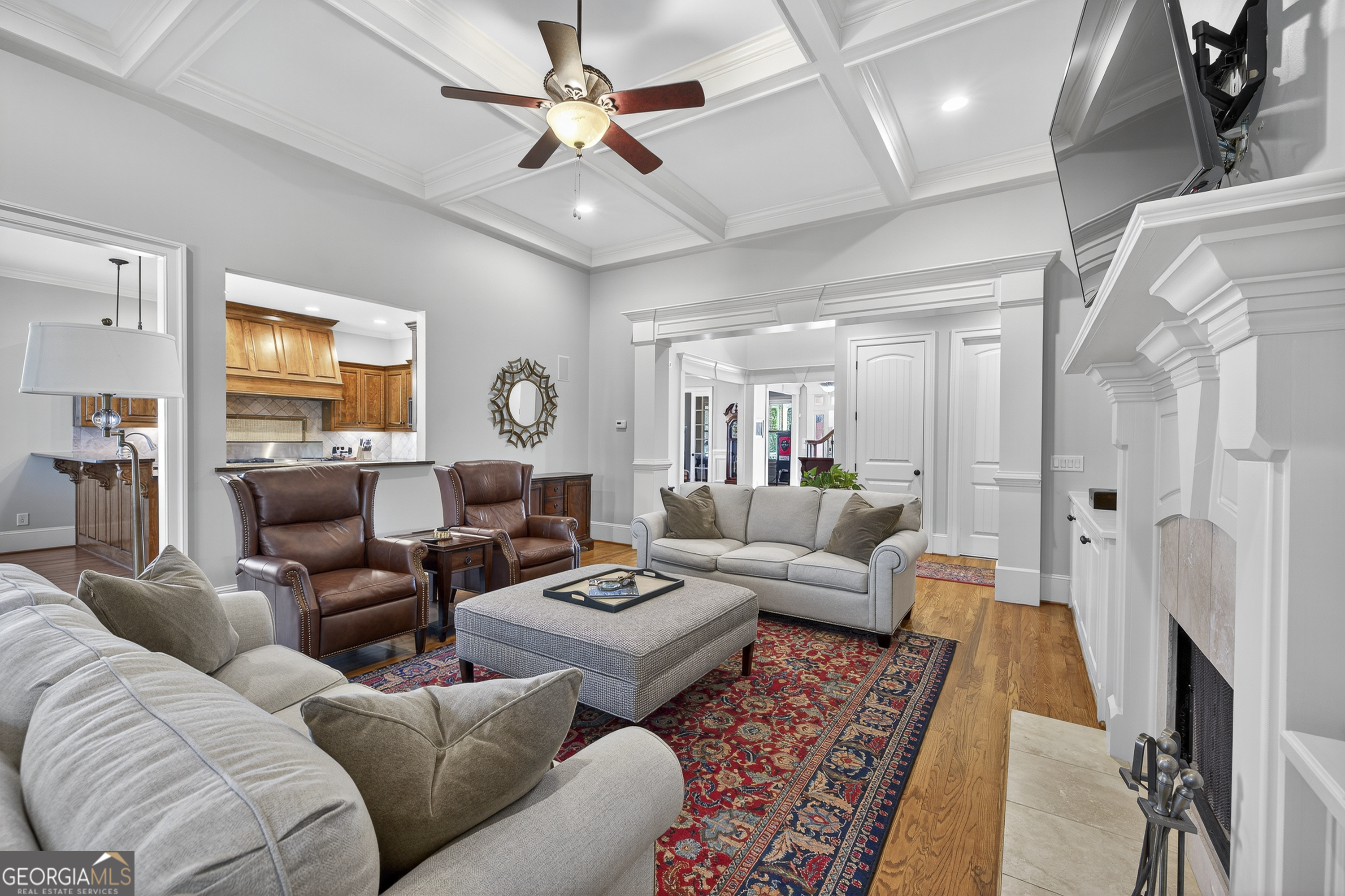 675 Garden Circle Statham, GA 30666 - Photo 17 of 98 a living room with furniture a fireplace and a chandelier