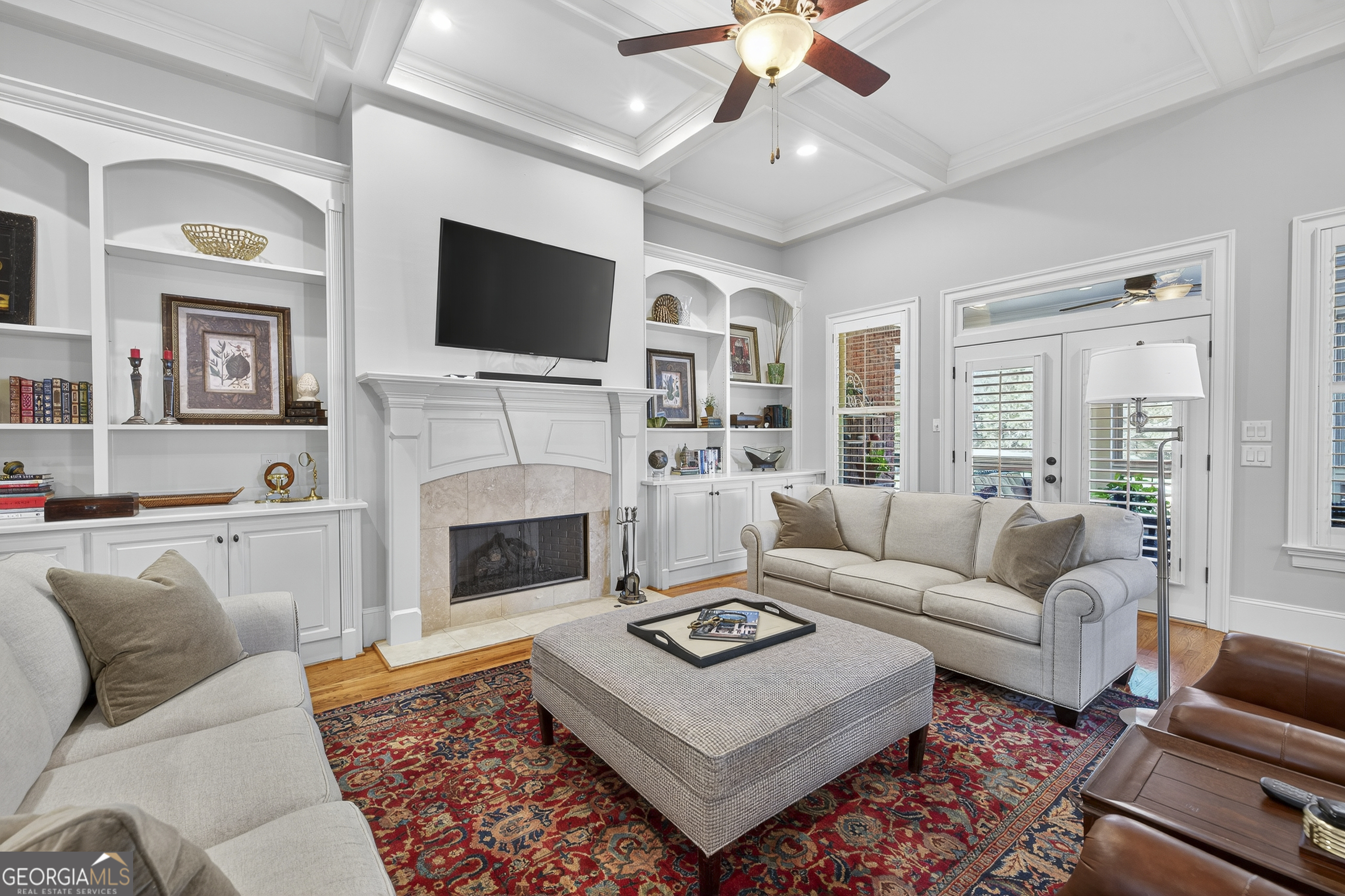 675 Garden Circle Statham, GA 30666 - Photo 20 of 98 a living room with furniture a flat screen tv and a fireplace