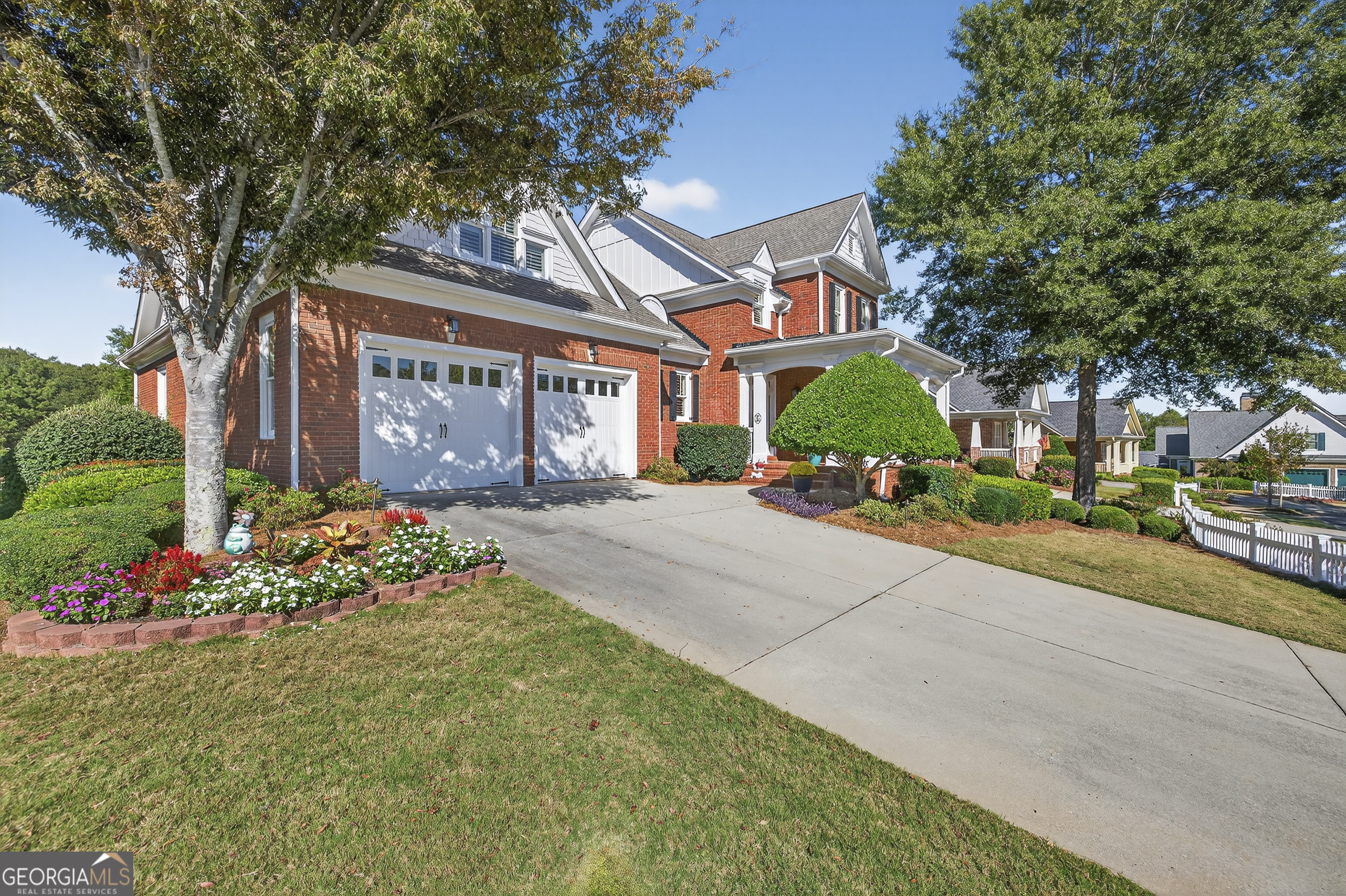 675 Garden Circle Statham, GA 30666 - Photo 2 of 98 a front view of a house with a yard and a garden