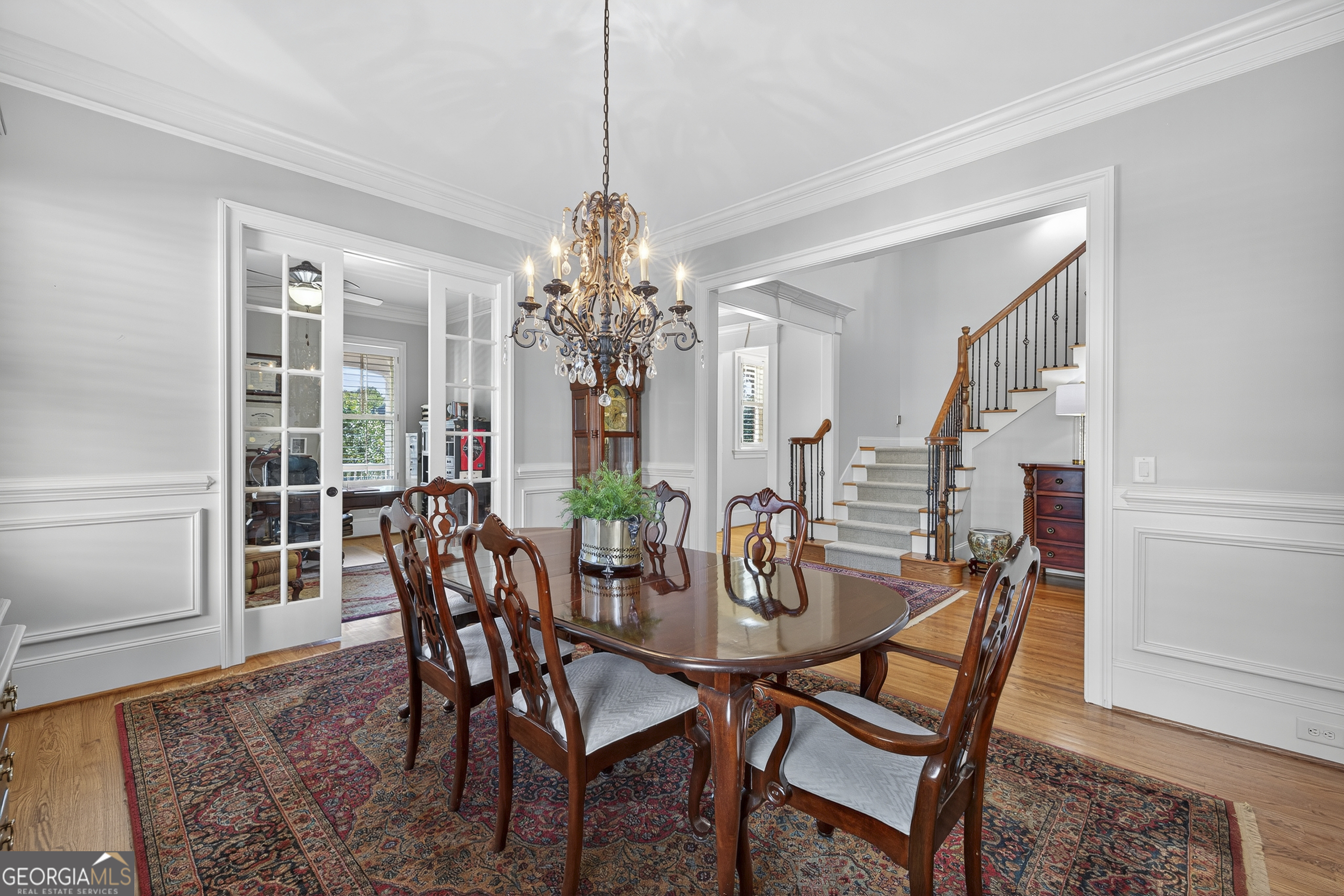 675 Garden Circle Statham, GA 30666 - Photo 32 of 98 a view of a dining room with furniture wooden floor and chandelier