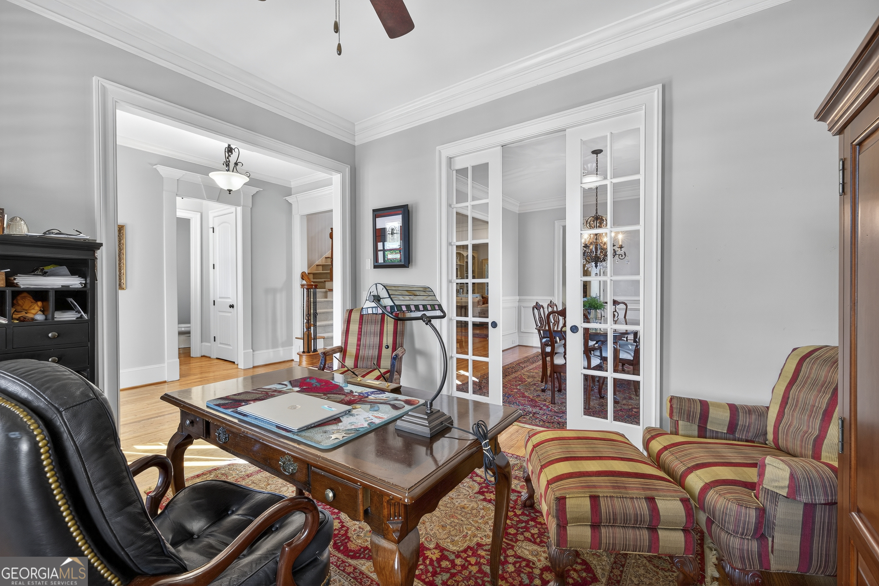 675 Garden Circle Statham, GA 30666 - Photo 34 of 98 a living room with furniture a table and a bookshelf