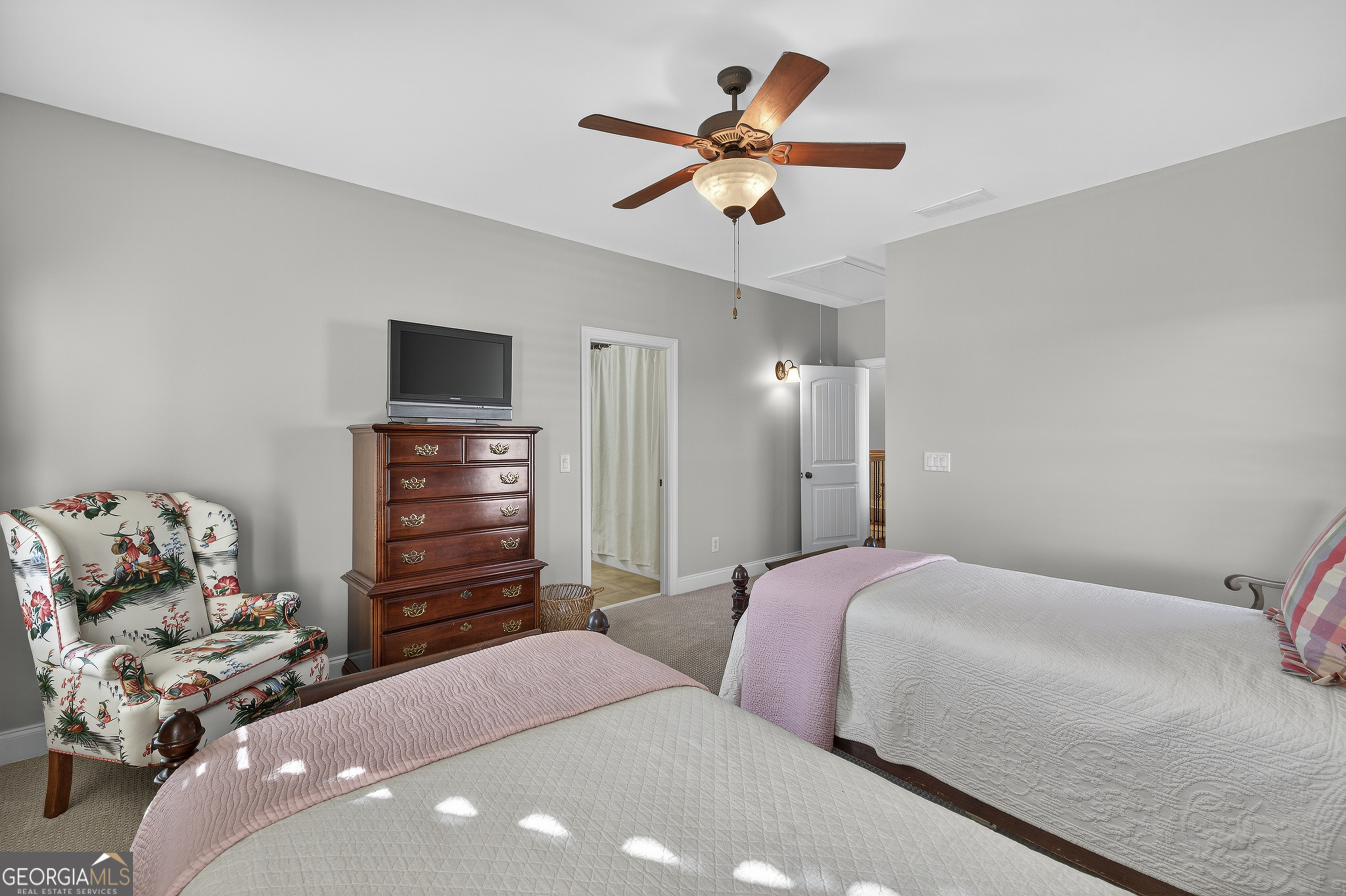 675 Garden Circle Statham, GA 30666 - Photo 51 of 98 a bedroom with a bed and a chandelier