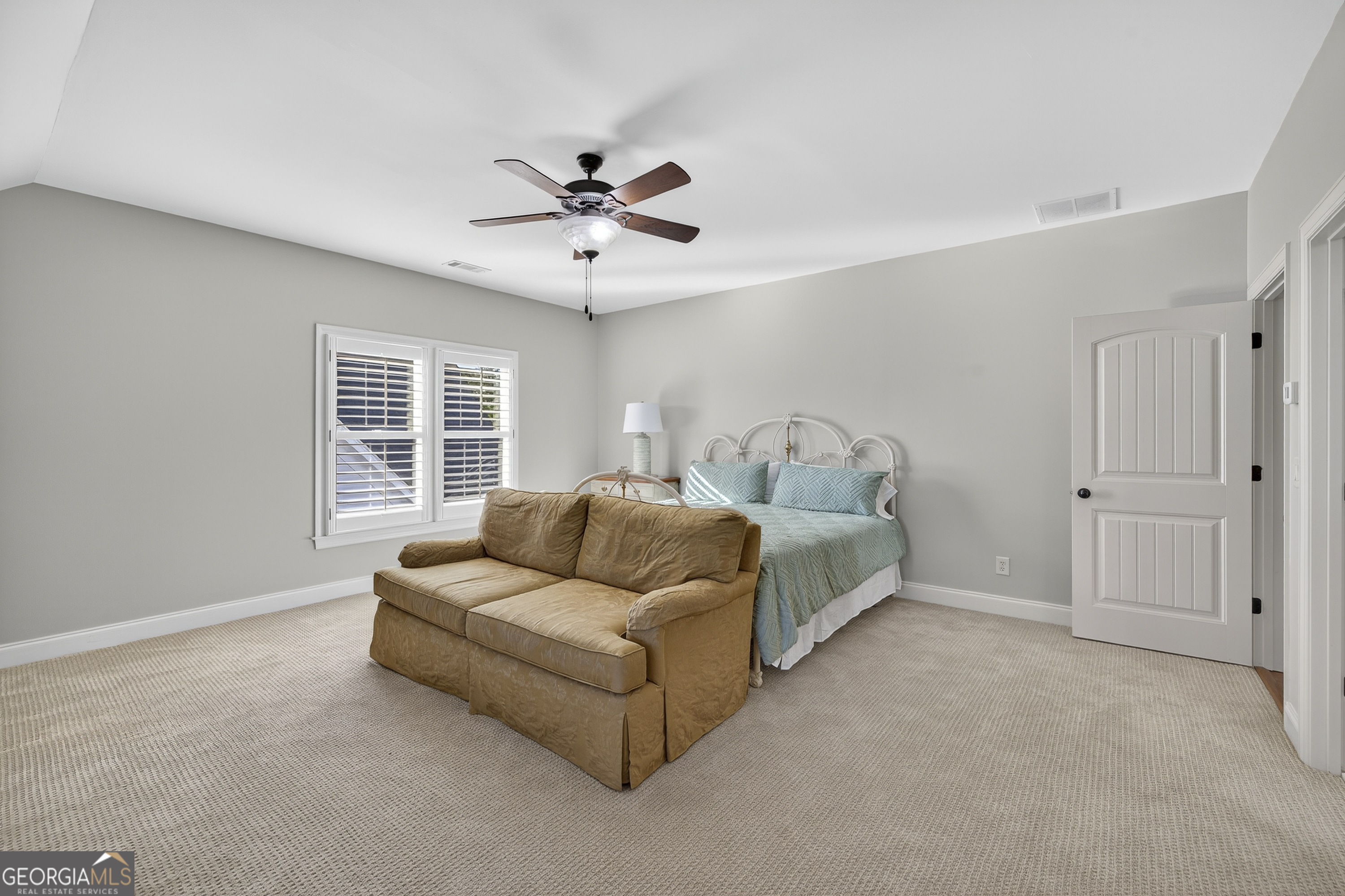 675 Garden Circle Statham, GA 30666 - Photo 61 of 98 a spacious bedroom with a bed furniture and a window