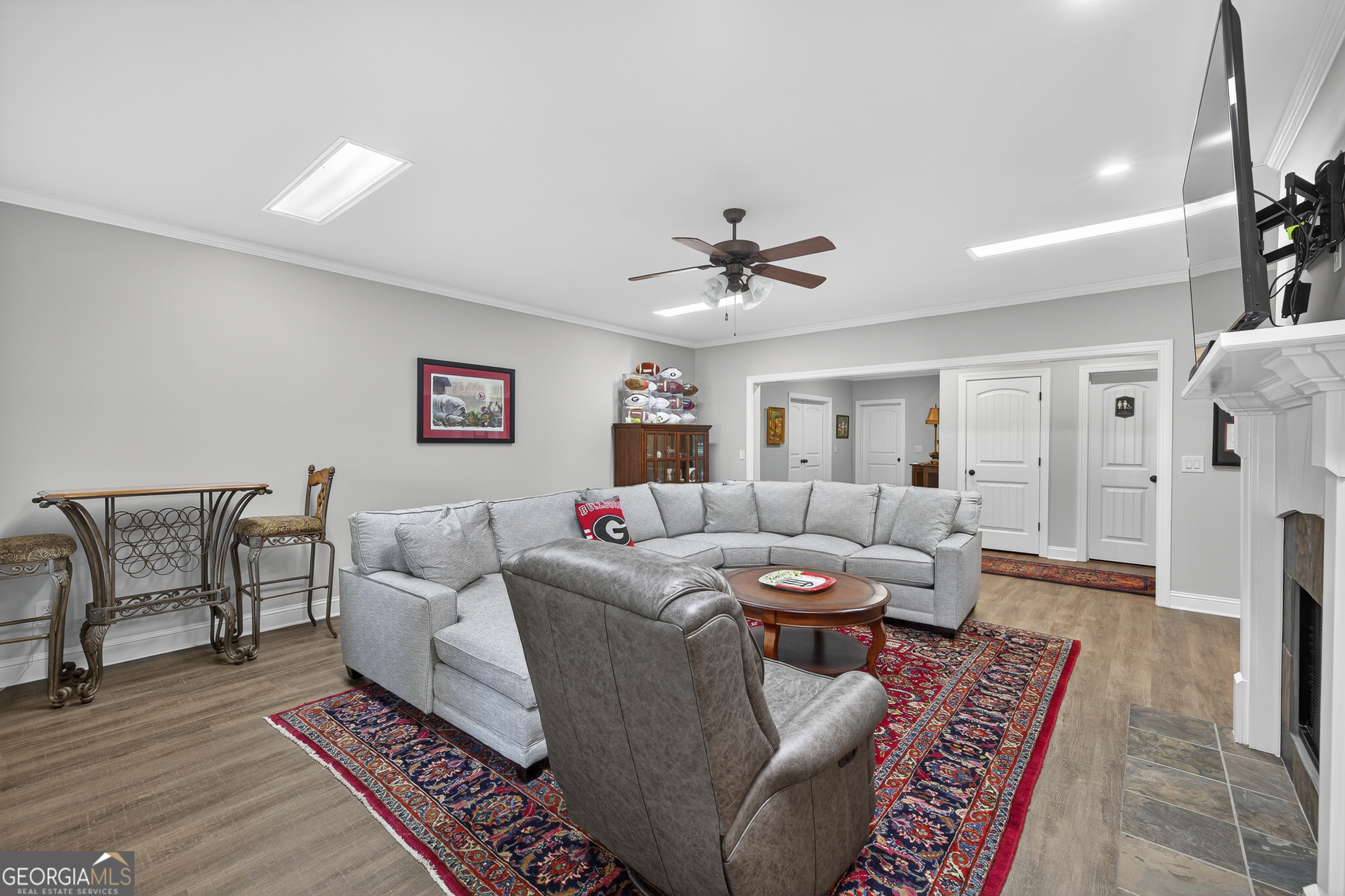 675 Garden Circle Statham, GA 30666 - Photo 78 of 98 a living room with furniture and a chandelier