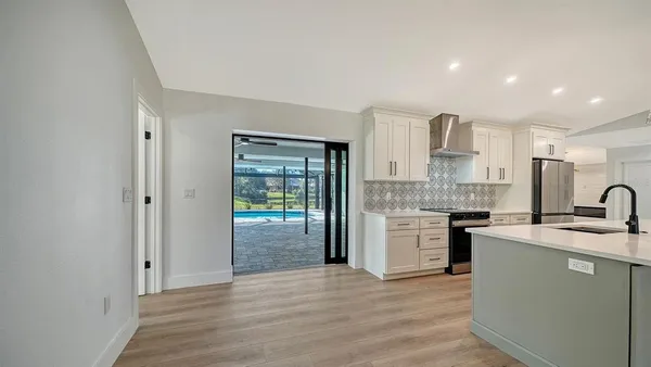 a view of an empty room with glass door