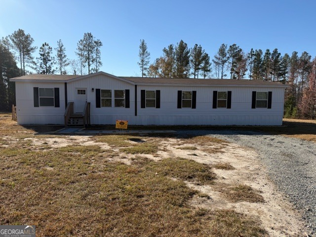 a house view with a backyard space