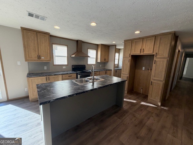 907 Orianna Road East Dublin, GA 31027 - Photo 18 of 21 a large kitchen with kitchen island granite countertop a sink and a refrigerator