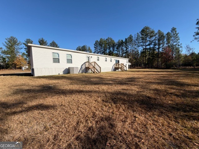 907 Orianna Road East Dublin, GA 31027 - Photo 4 of 21 a view of a dry yard with wooden fence