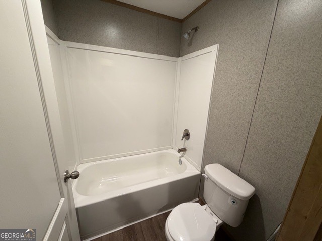 907 Orianna Road East Dublin, GA 31027 - Photo 10 of 21 a bathroom with a toilet and a bathtub