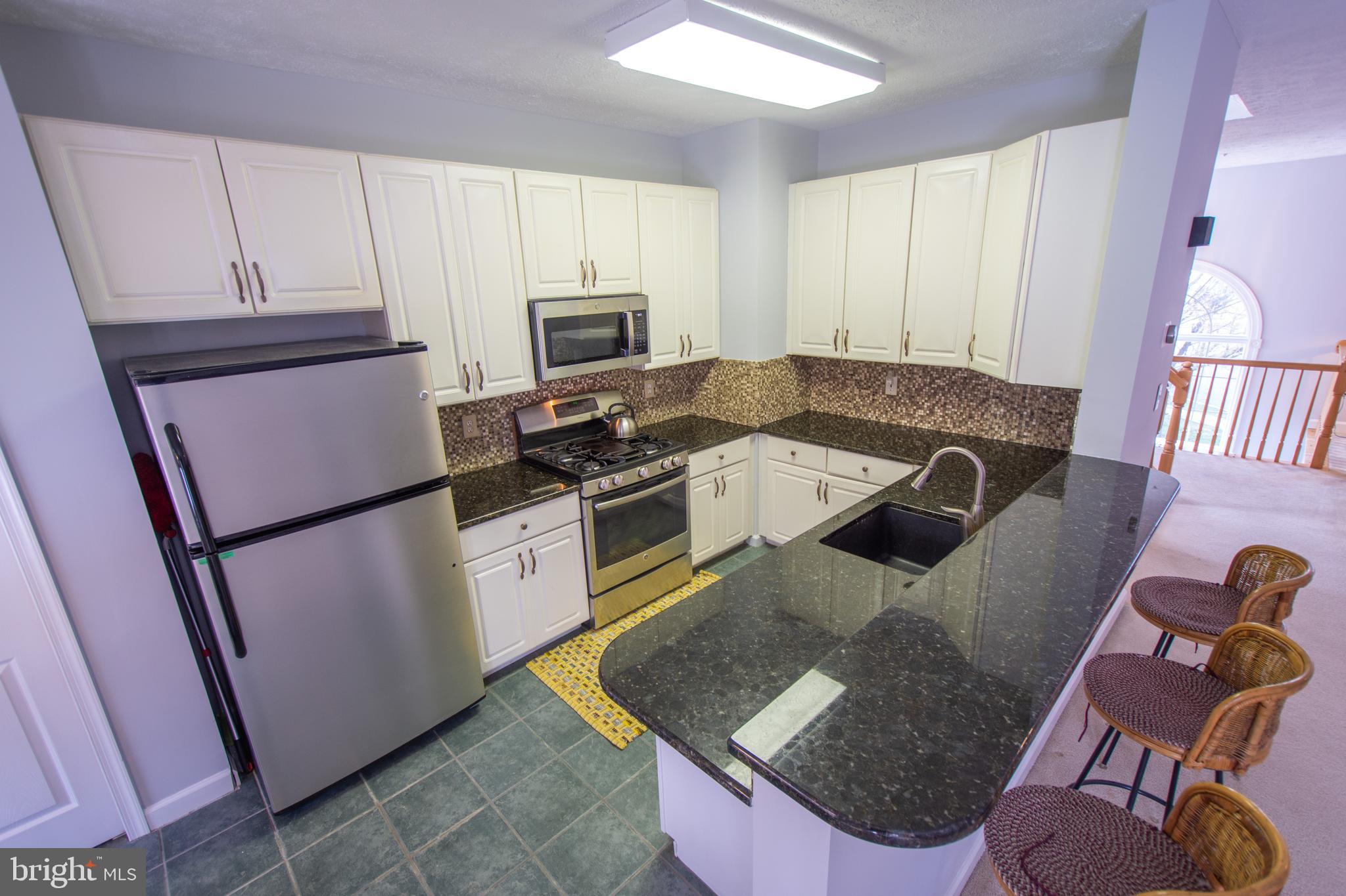 3253 Escapade Circle Riva, MD 21140 - Photo 14 of 61 Kitchen With Granite Counter Tops