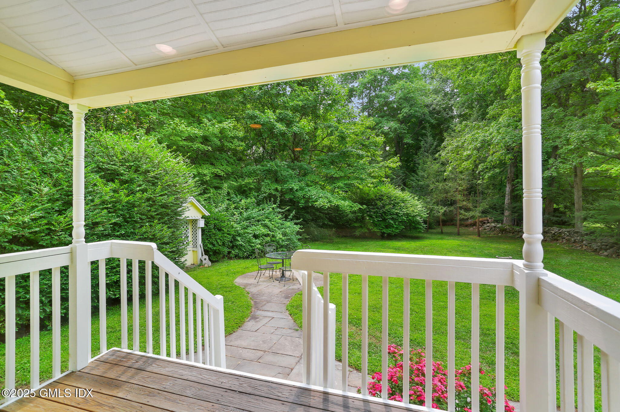27 Seeley Road Wilton, CT 06897 - Photo 22 of 27 a view of a wooden deck and a yard
