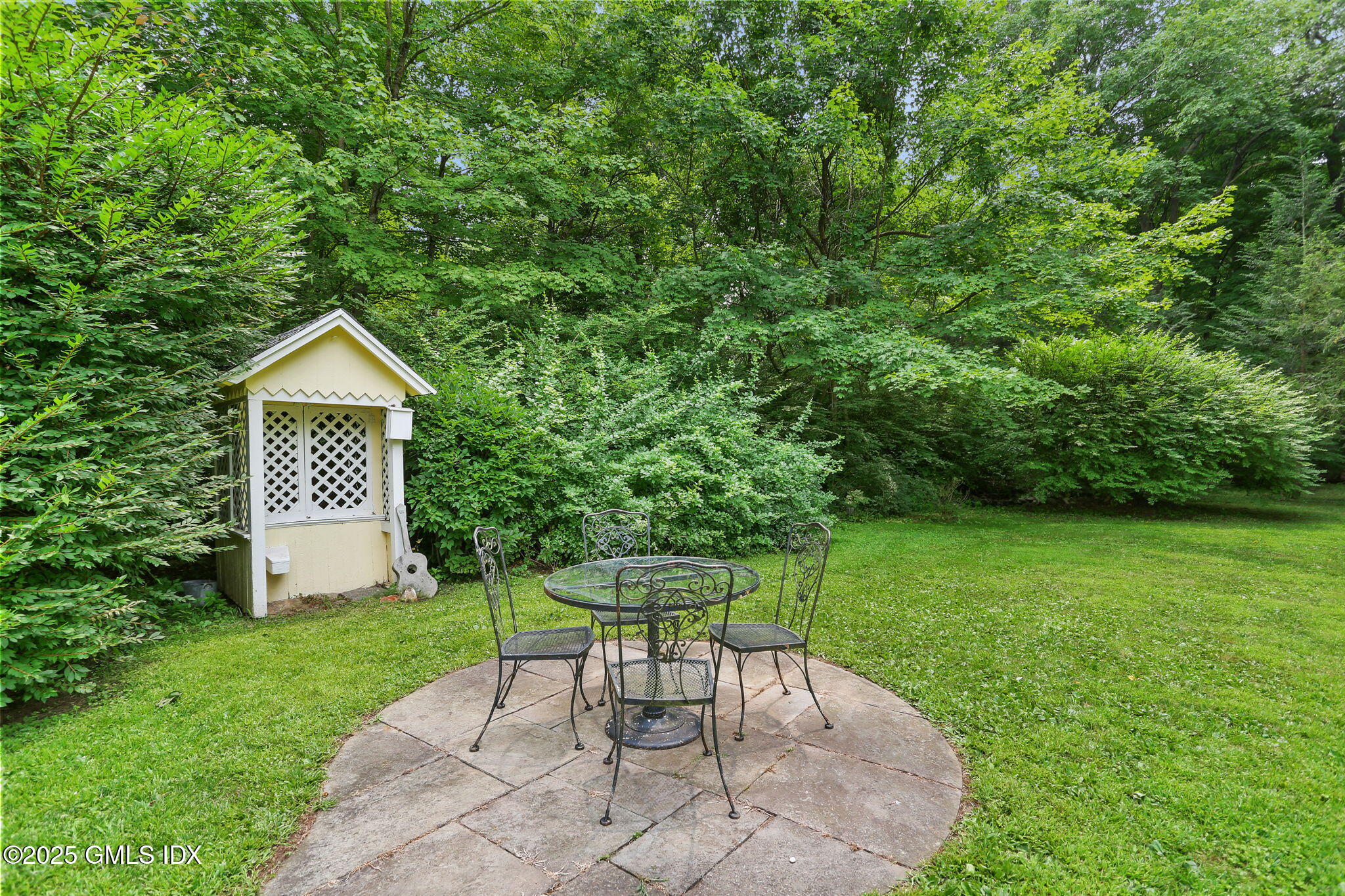 27 Seeley Road Wilton, CT 06897 - Photo 26 of 27 a view of a chairs and table in the garden