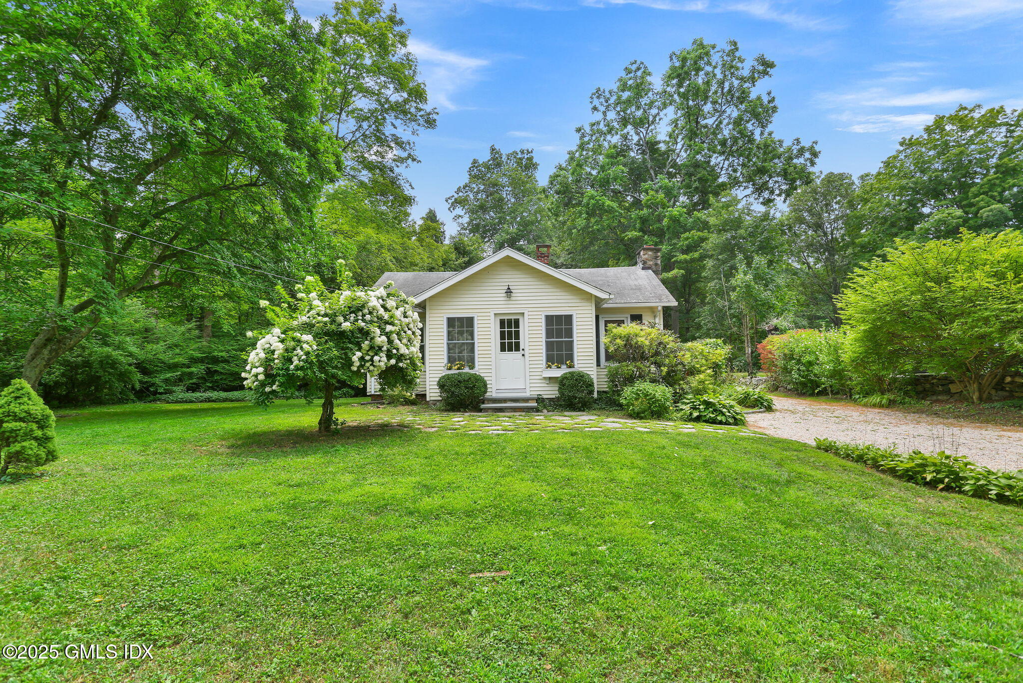 27 Seeley Road Wilton, CT 06897 - Photo 27 of 27 a house that is sitting in the grass