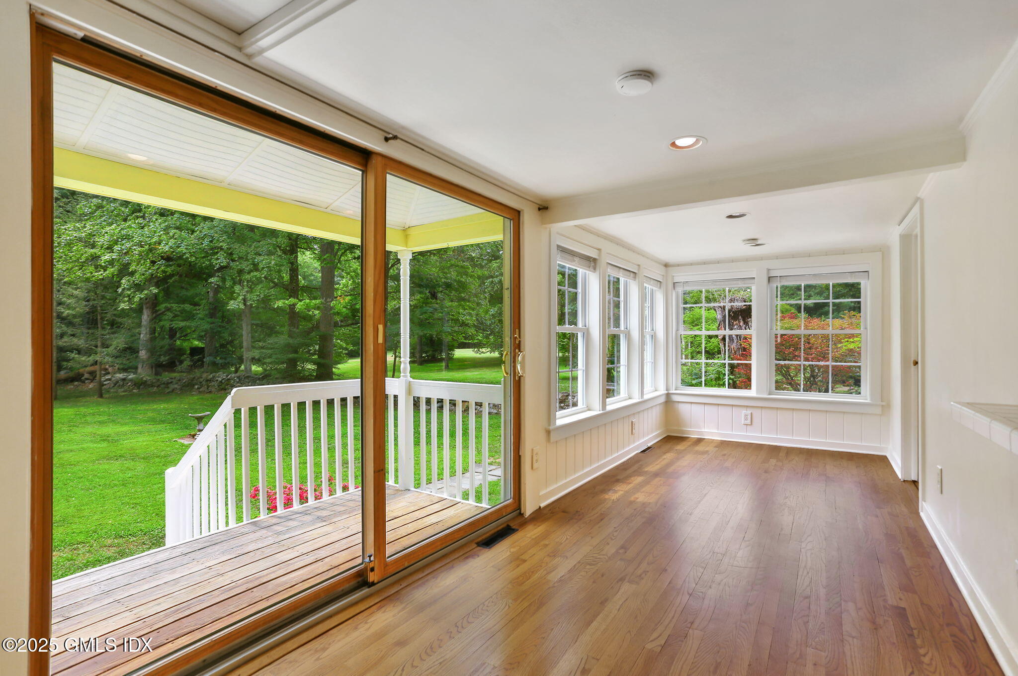 27 Seeley Road Wilton, CT 06897 - Photo 6 of 27 a view of porch with a floor to ceiling window and wooden floor