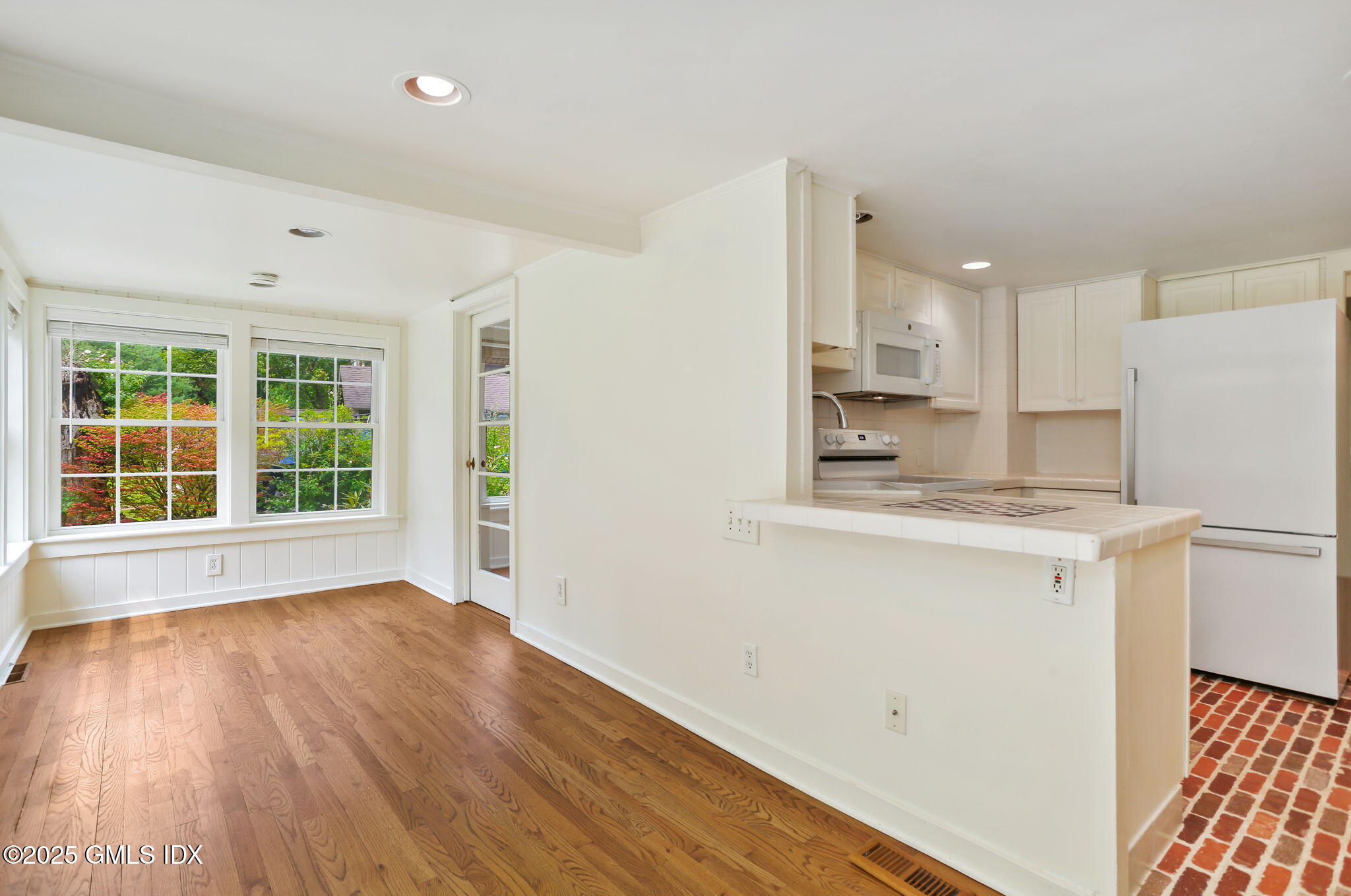 27 Seeley Road Wilton, CT 06897 - Photo 8 of 27 a view of a kitchen with wooden floor and electronic appliances