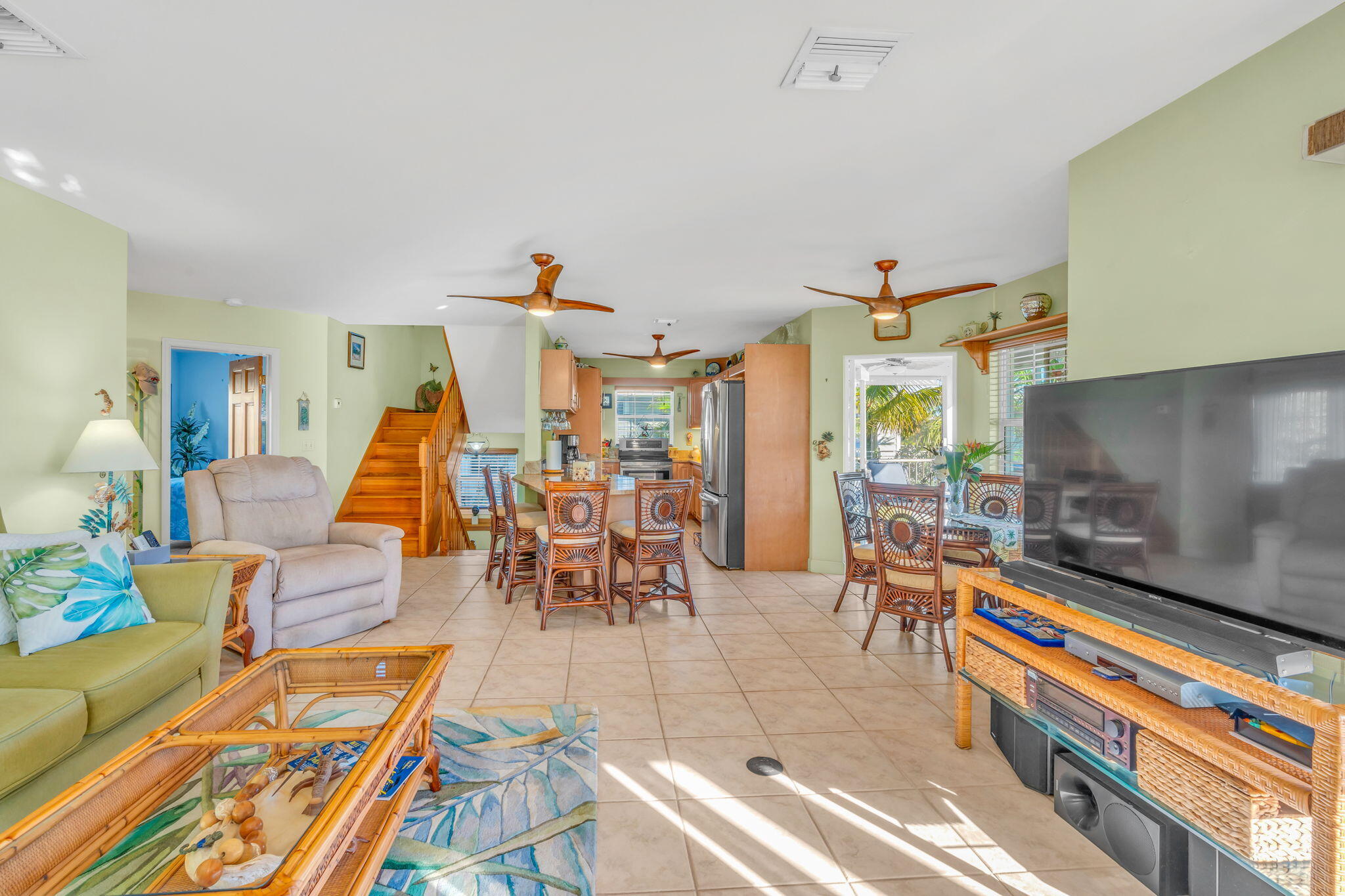 28560 Doubloon Road Summerland Key, FL 33042 - Photo 15 of 52 a living room filled with furniture and a dining table