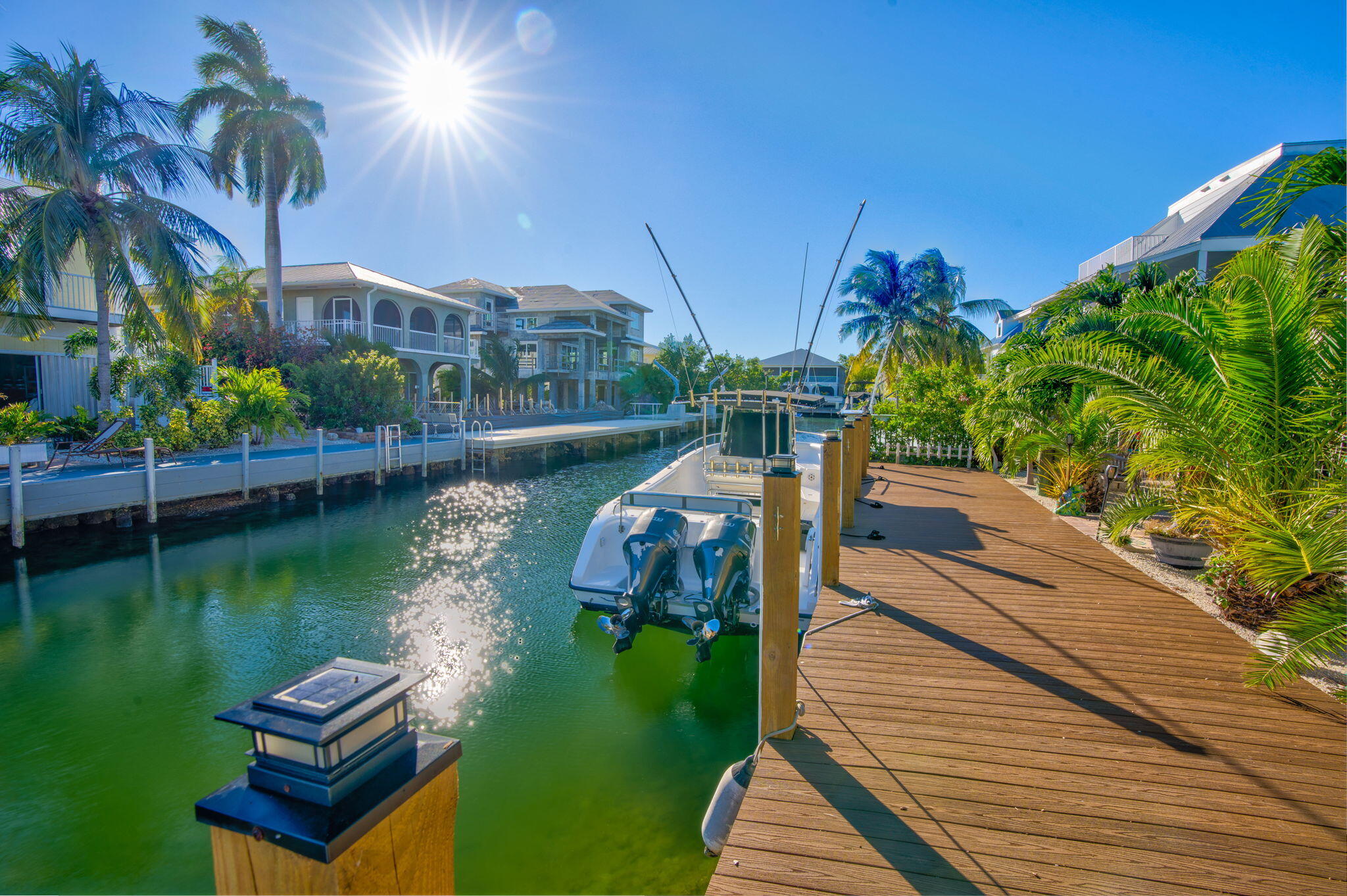 28560 Doubloon Road Summerland Key, FL 33042 - Photo 4 of 52 a view of a lake with a bench in the background